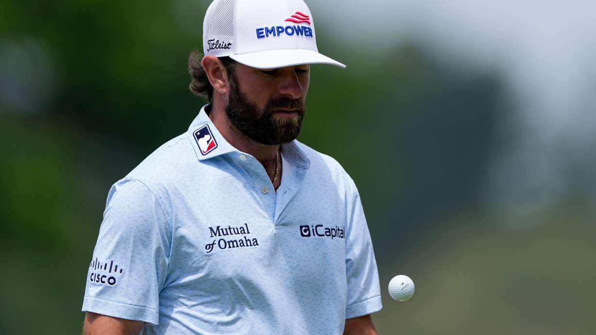 Cameron Young reacts tosses his ball on the fourth green during a PGA Championship golf tournament practice round at Aronimink Golf Club, Wednesday, May 13, 2026, in Newtown Square, PA.