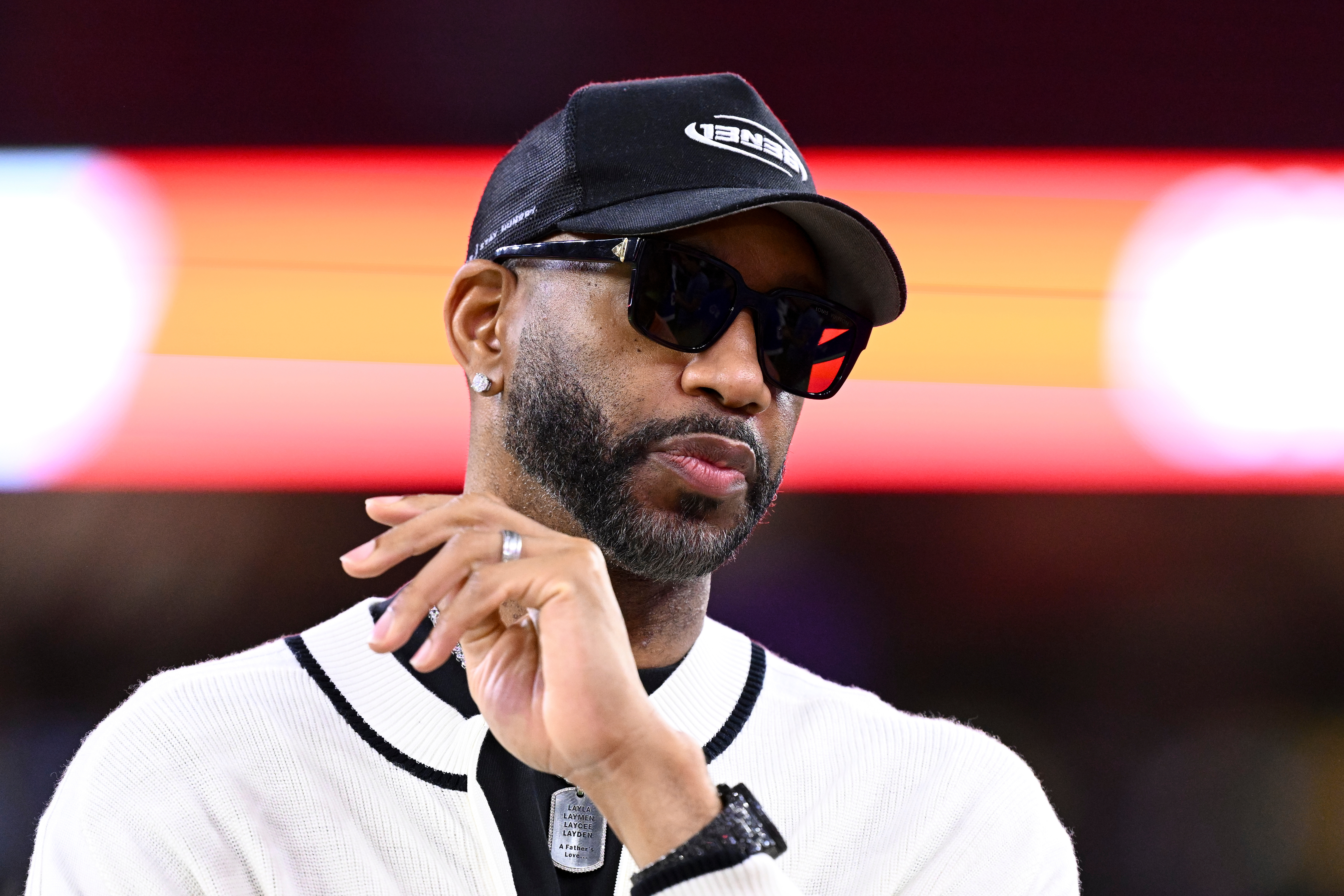 FILE - Basketball Hall of Famer Tracy McGrady stands on the sideline prior an NFL football game between the Houston Texans and the Buffalo Bills, Nov. 20, 2025, in Houston. 
