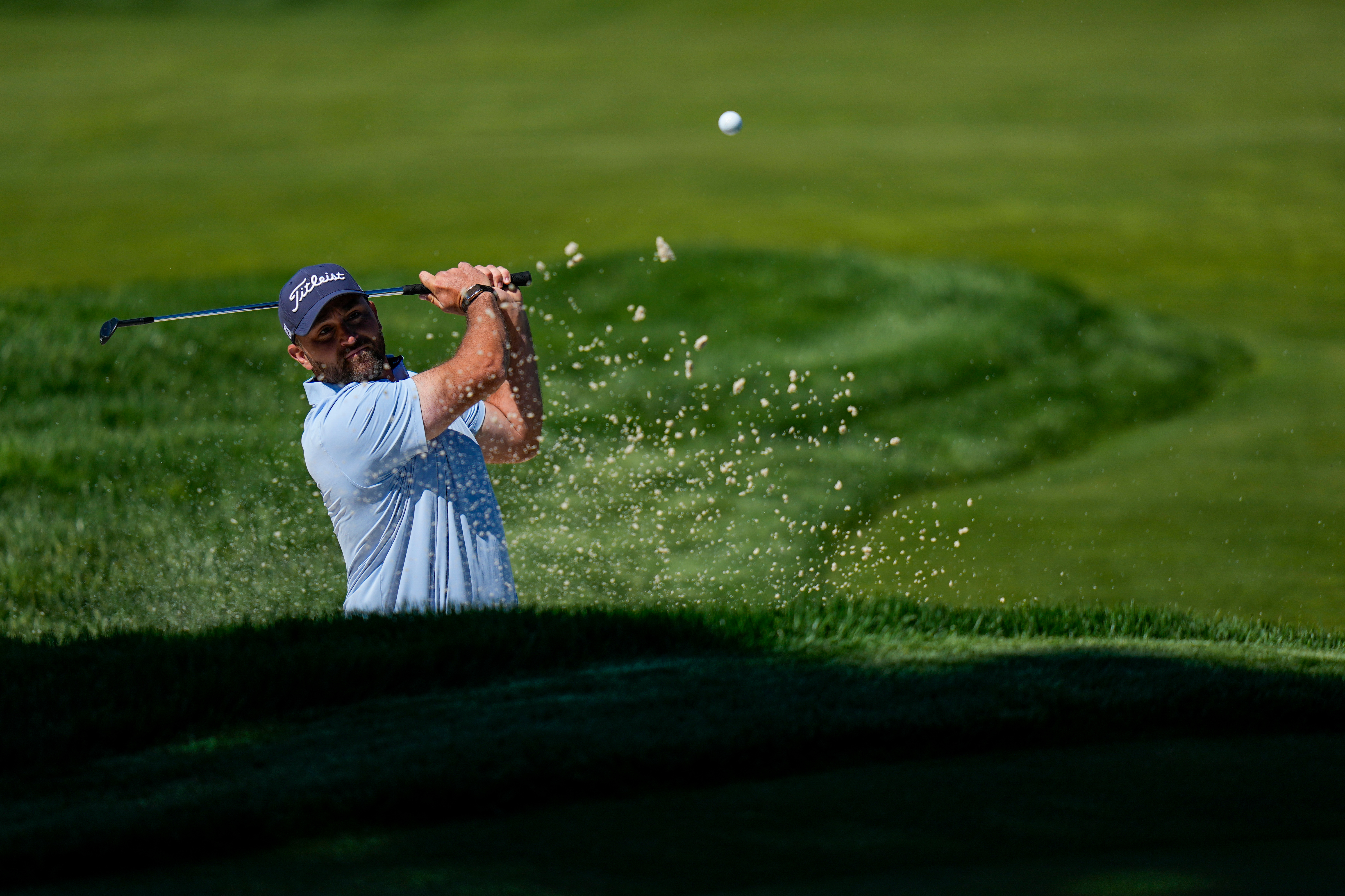 Braden Shattuck hits from the bunker during a PGA Championship golf tournament practice round at Aronimink Golf Club, Tuesday, May 12, 2026, in Newtown Square, PA. 