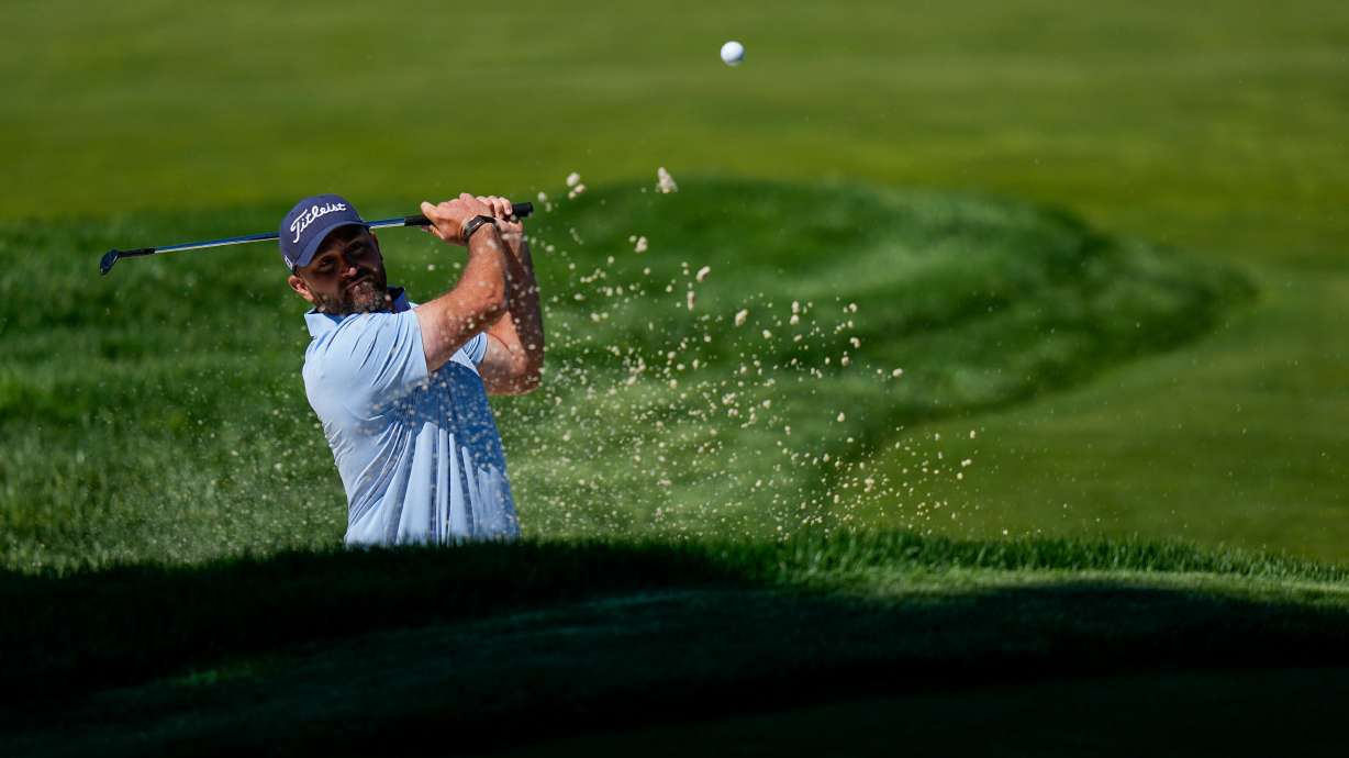 Braden Shattuck hits from the bunker during a PGA Championship golf tournament practice round at Aronimink Golf Club, Tuesday, May 12, 2026, in Newtown Square, PA.