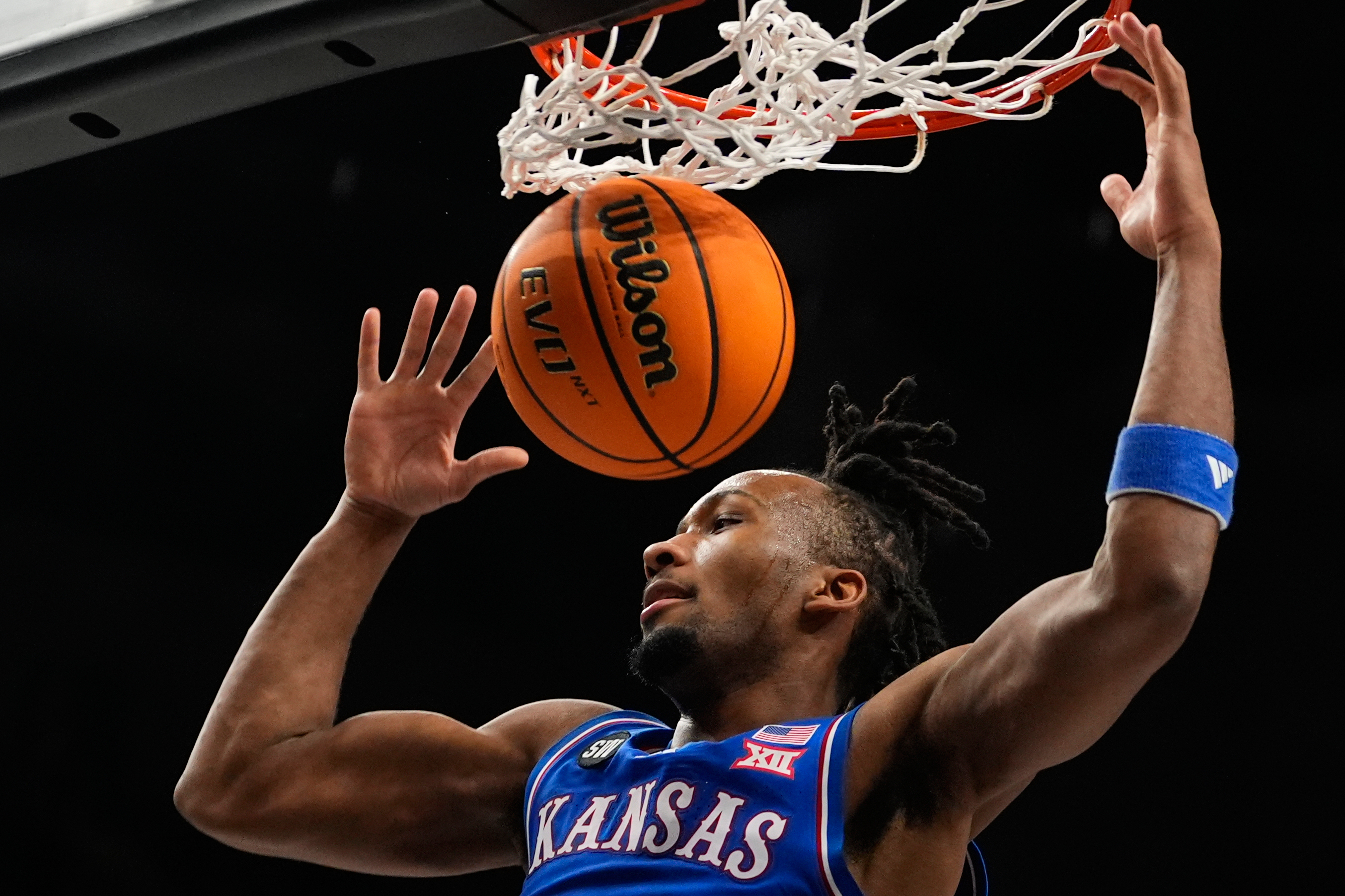 FILE - Kansas' Darryn Peterson dunks during the first half of an NCAA college basketball game against Houston in the semifinal round of the Big 12 Conference tournament March 13, 2026, in Kansas City, Mo. 