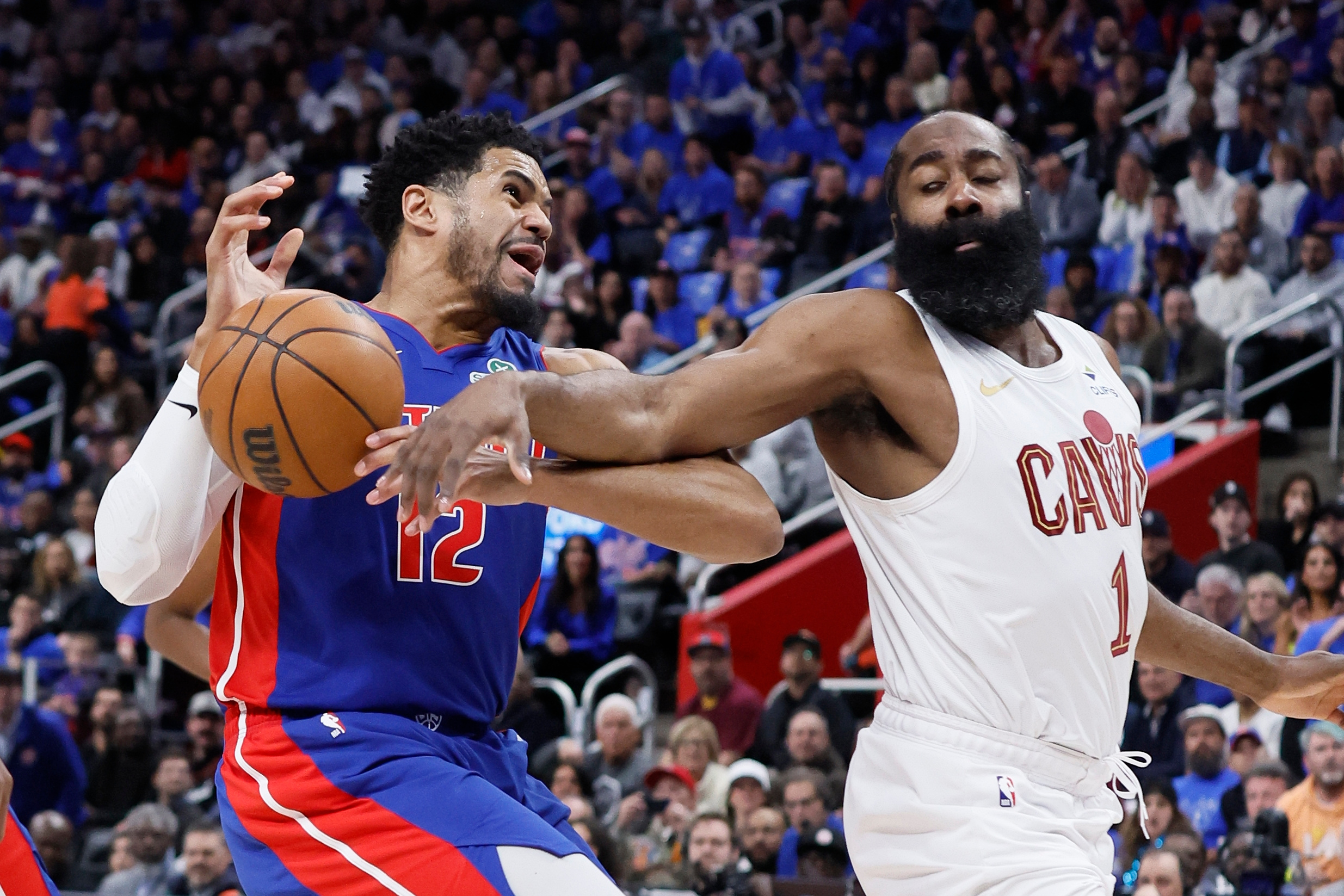 Cleveland Cavaliers guard James Harden (1) knocks the ball out of the hands of Detroit Pistons forward Tobias Harris (12) while going to the basket during the first half in Game 5 of a second-round NBA playoffs basketball series Wednesday, May 13, 2026, in Detroit. 