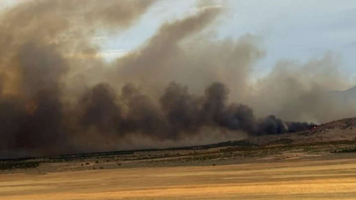 Gusty winds are fueling a large wildfire southwest of Leamington in Millard County, which grew to an estimated 1,000 acres on Wednesday.