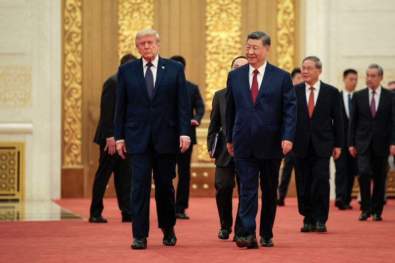 President Donald Trump and Chinese President Xi Jinping arrive to attend a state banquet at the Great Hall of the People in Beijing, Thursday.