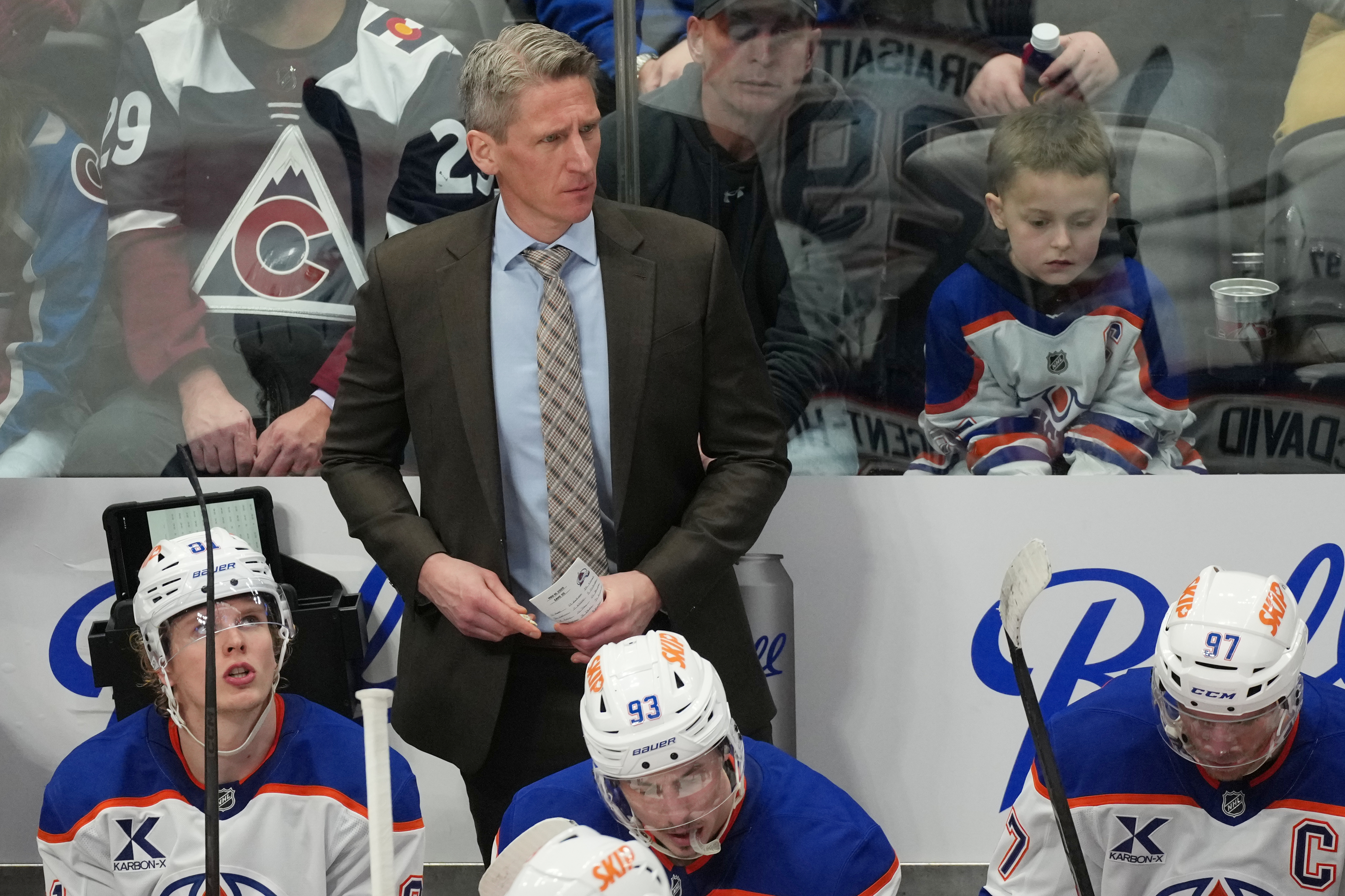 FILE - Edmonton Oilers head coach Kris Knoblauch looks on from behind the bench during the third period of an NHL hockey game, Tuesday, March 10, 2026, in Denver.
