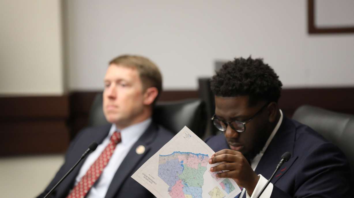 South Carolina Democratic Rep. Keishan Scott looks at a proposed U.S. House district map during a redistricting hearing in a state House Judiciary subcommittee on May 12 in Columbia, S.C.