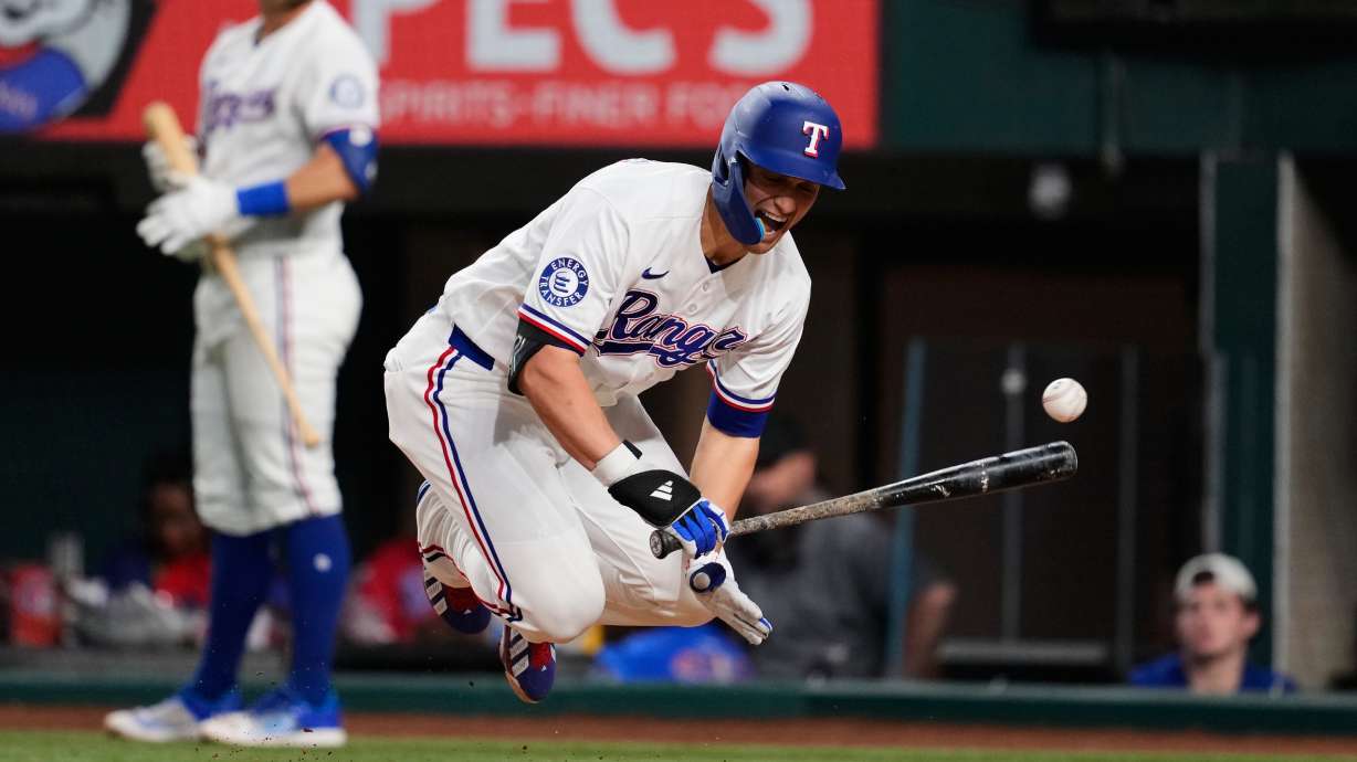 Texas Rangers' Corey Seager reacts to being hit by a pitch in the ninth inning of a baseball game against the Arizona Diamondbacks Monday, May 11, 2026, in Arlington, Texas.