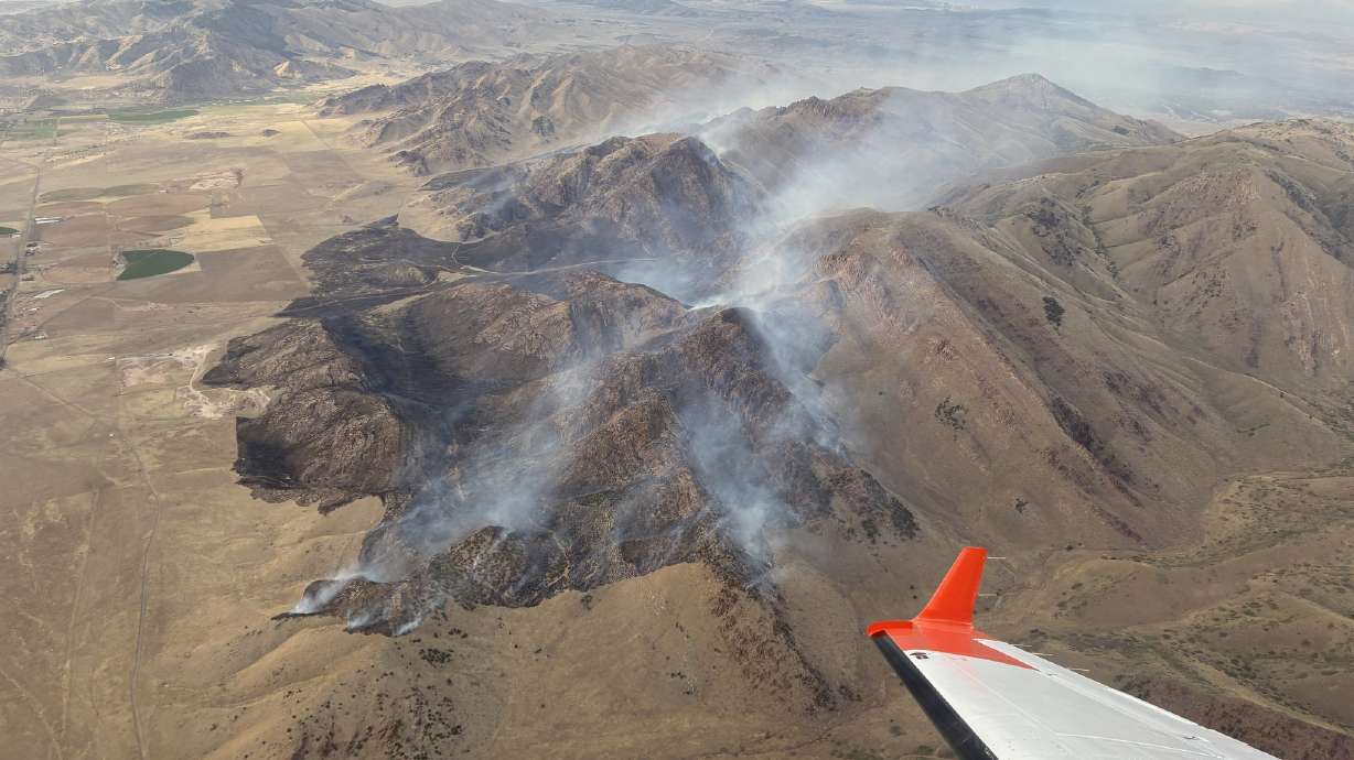 The Wild Horse Fire burns in Millard County on Wednesday. Firefighters say lightning caused the fire that has now burned 1,500 acres.