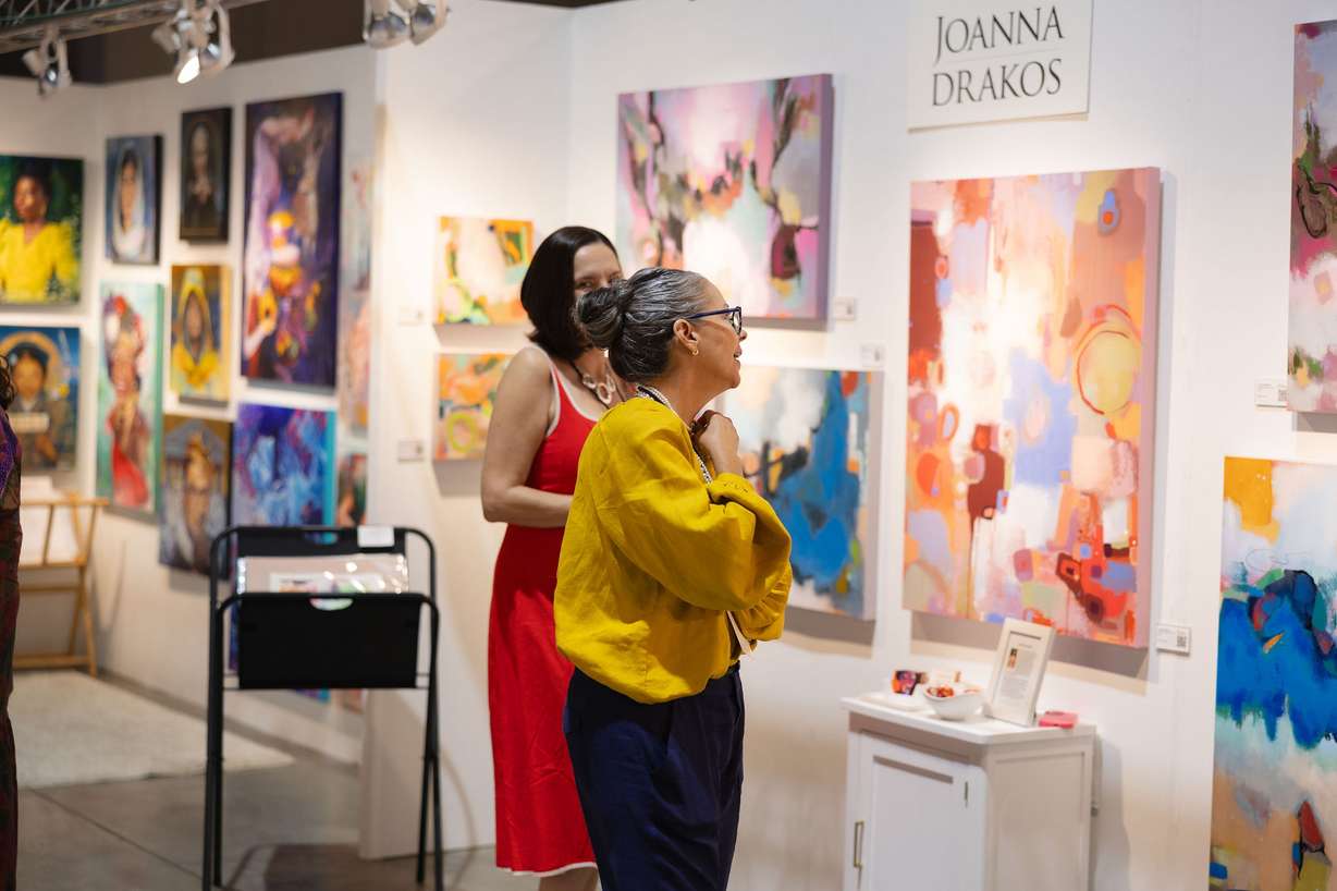 An attendee interacts with an artist during the 2024 Reno Tahoe International Art Show. Utah's first indoor, international art show will be held at the Mountain America Expo Center on May 15-17.