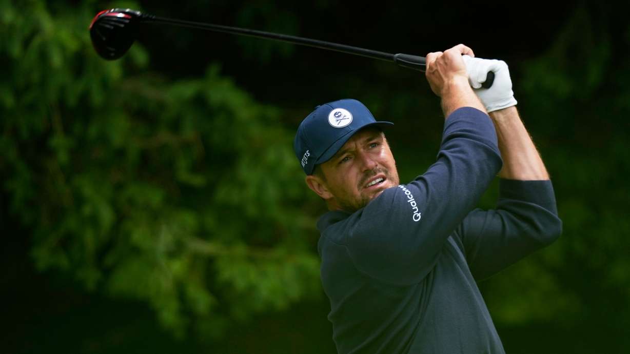 Bryson DeChambeau watches his tee shot on the fourth hole during the first round of the PGA Championship golf tournament practice round at Aronimink Golf Club, Thursday, May 14, 2026, in Newtown Square, PA.