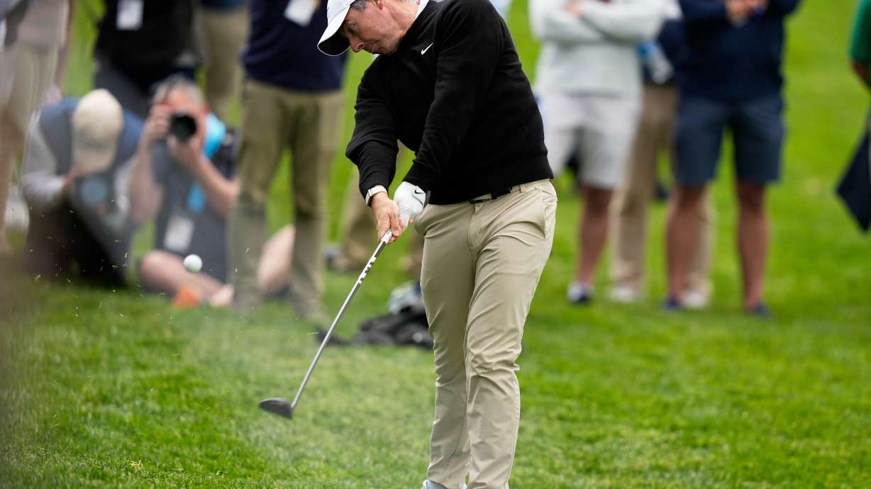 Rory McIlroy, of Northern Ireland, hits from the rough on the ninth hole during the first round of the PGA Championship golf tournament practice round at Aronimink Golf Club, Thursday, May 14, 2026, in Newtown Square, PA.