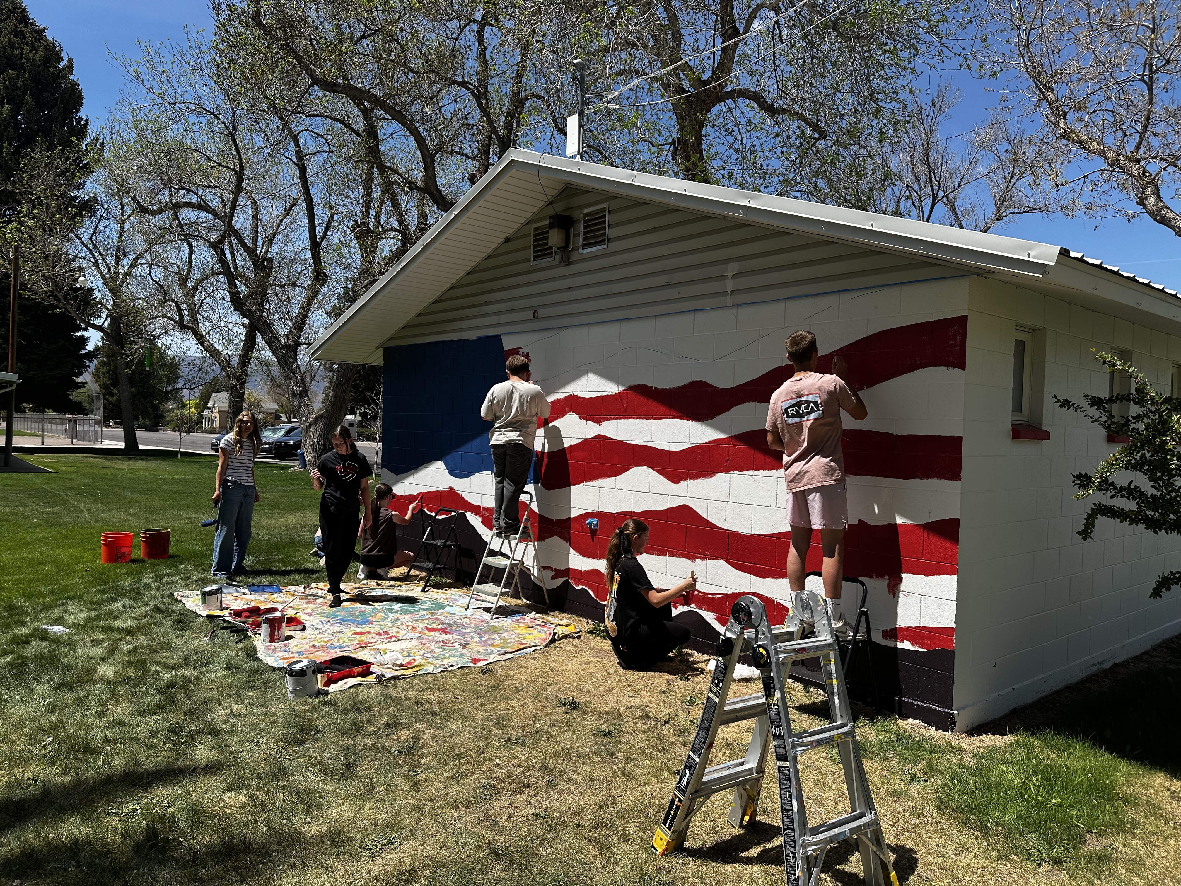 South Sevier Middle School students paint a mural at Lion's Park in Monroe to commemorate the country's 250th anniversary.
