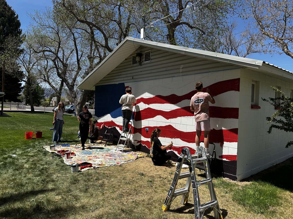 South Sevier Middle School students paint a mural at Lion's Park in Monroe to commemorate the country's 250th anniversary.