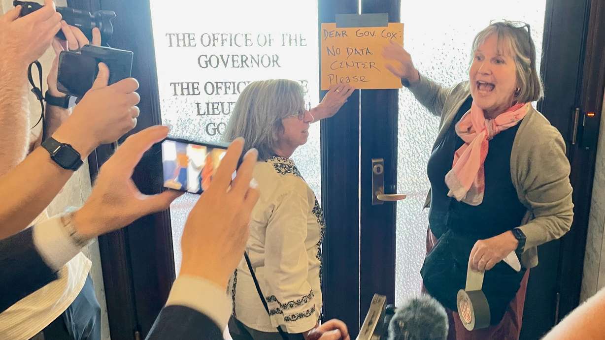 Deeda Seed, right, is pictured outside the office of Gov. Spencer Cox at the Utah Capitol in Salt Lake City on Thursday, when hundreds gathered to rally against a Box Elder County data center proposal. She turned in a letter of opposition to the proposal to one of Cox's staffers.