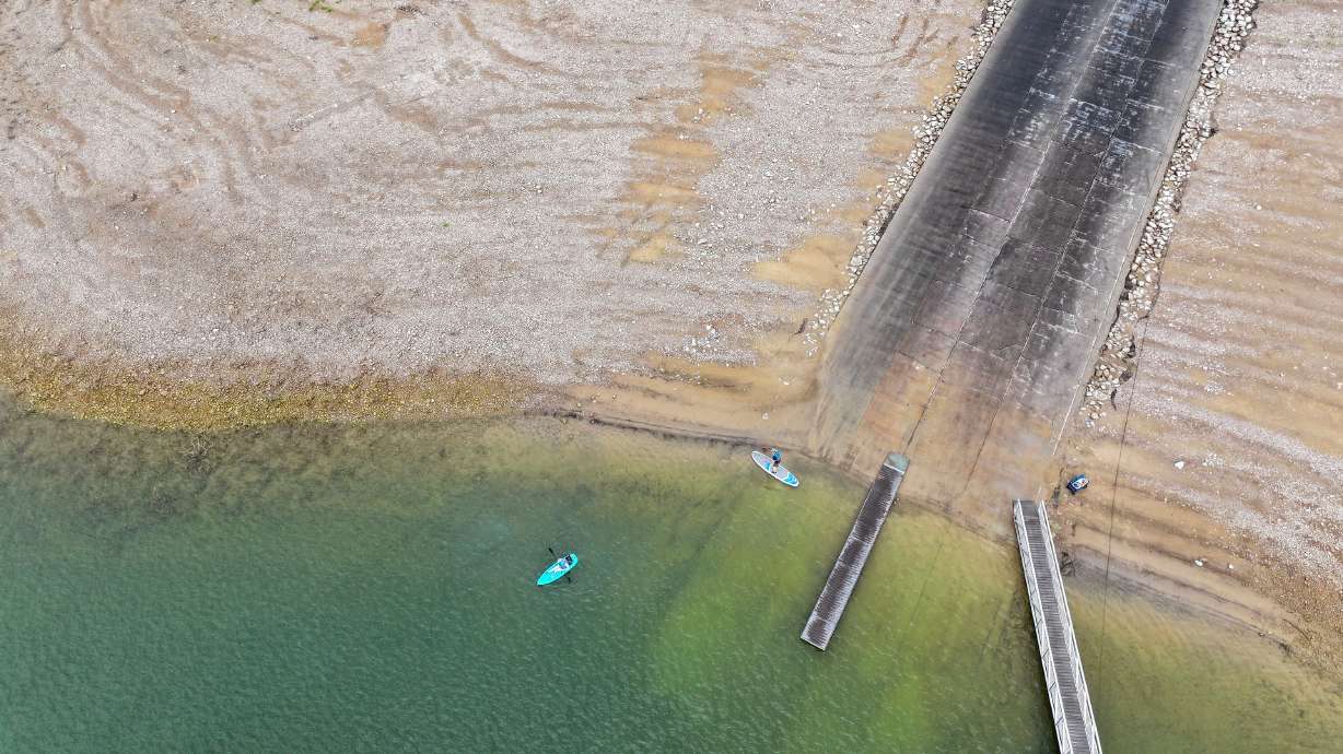 Randy and Annette Smith, of Grantsville, head out to kayak and paddleboard at Echo Reservoir at Echo State Park in Coalville on Aug. 22, 2025. The reservoir is 60% full and is at risk of challenges this summer.