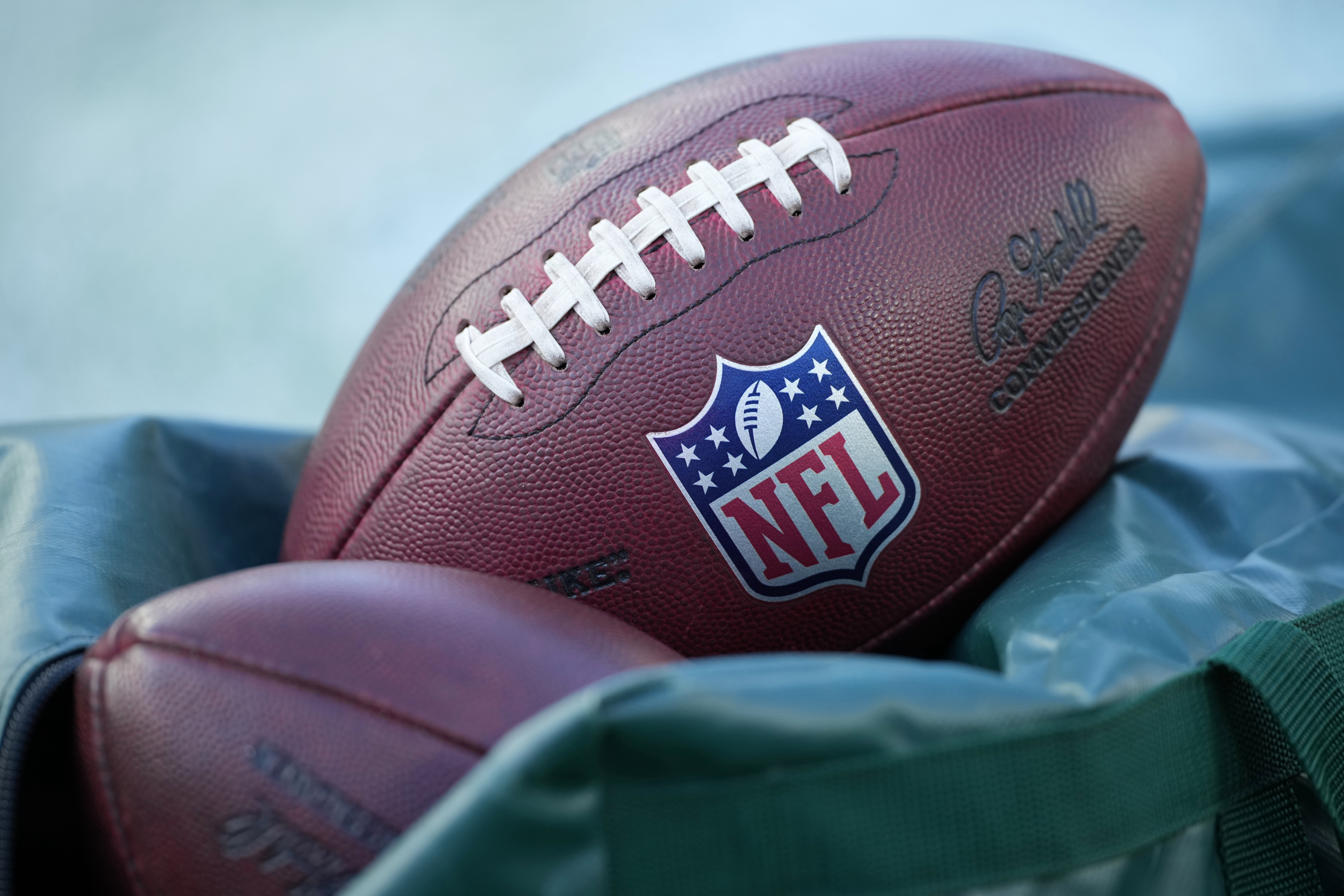 FILE - Footballs are seen before an NFL football game between the Philadelphia Eagles and the Washington Commanders on Jan. 4, 2026, in Philadelphia. 