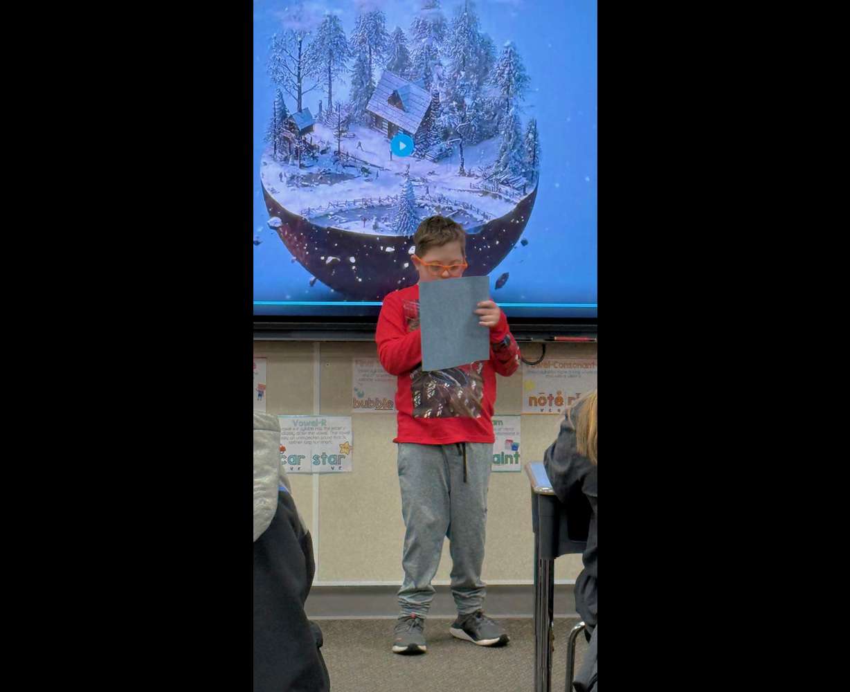 Ten-year-old Jude Garrett reads his snow globe story to his fourth-grade class at North Ogden Elementary School in North Ogden.
