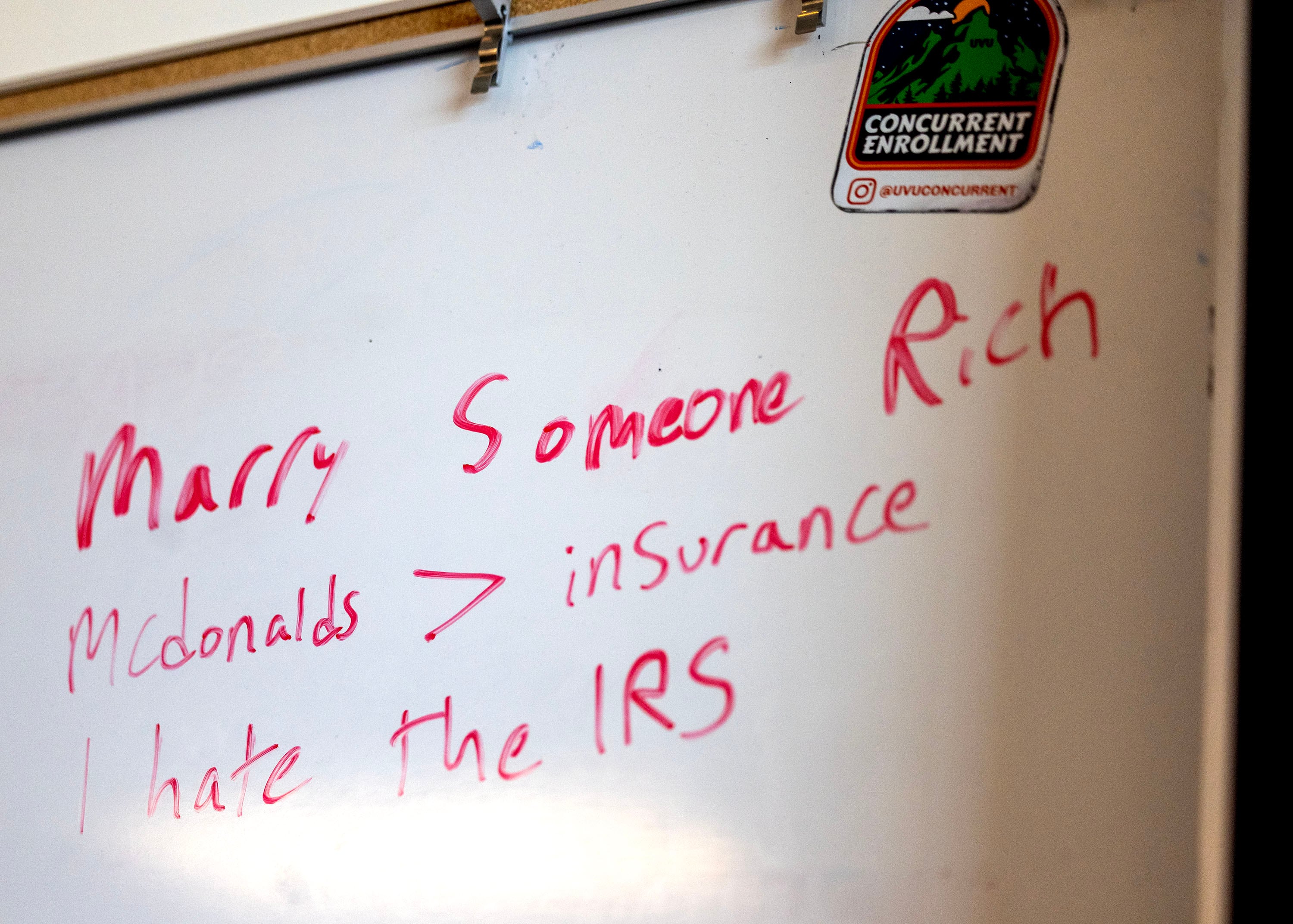 Students jot down what they have learned in Michelle Butler's financial literacy class at Brighton High School in Cottonwood Heights on Thursday.