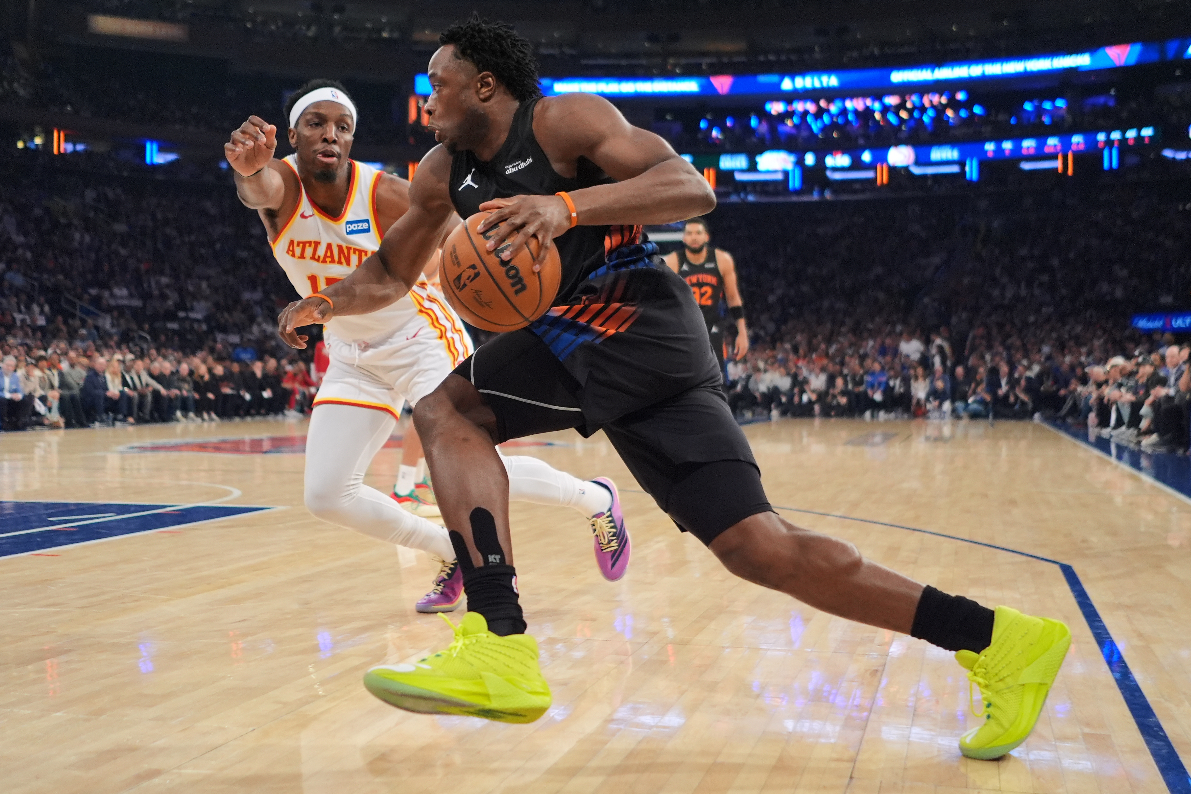 New York Knicks' OG Anunoby, right, drives past Atlanta Hawks' Onyeka Okongwu during the first half in Game 5 of a first-round NBA playoffs basketball series, Tuesday, April 28, 2026, in New York. 