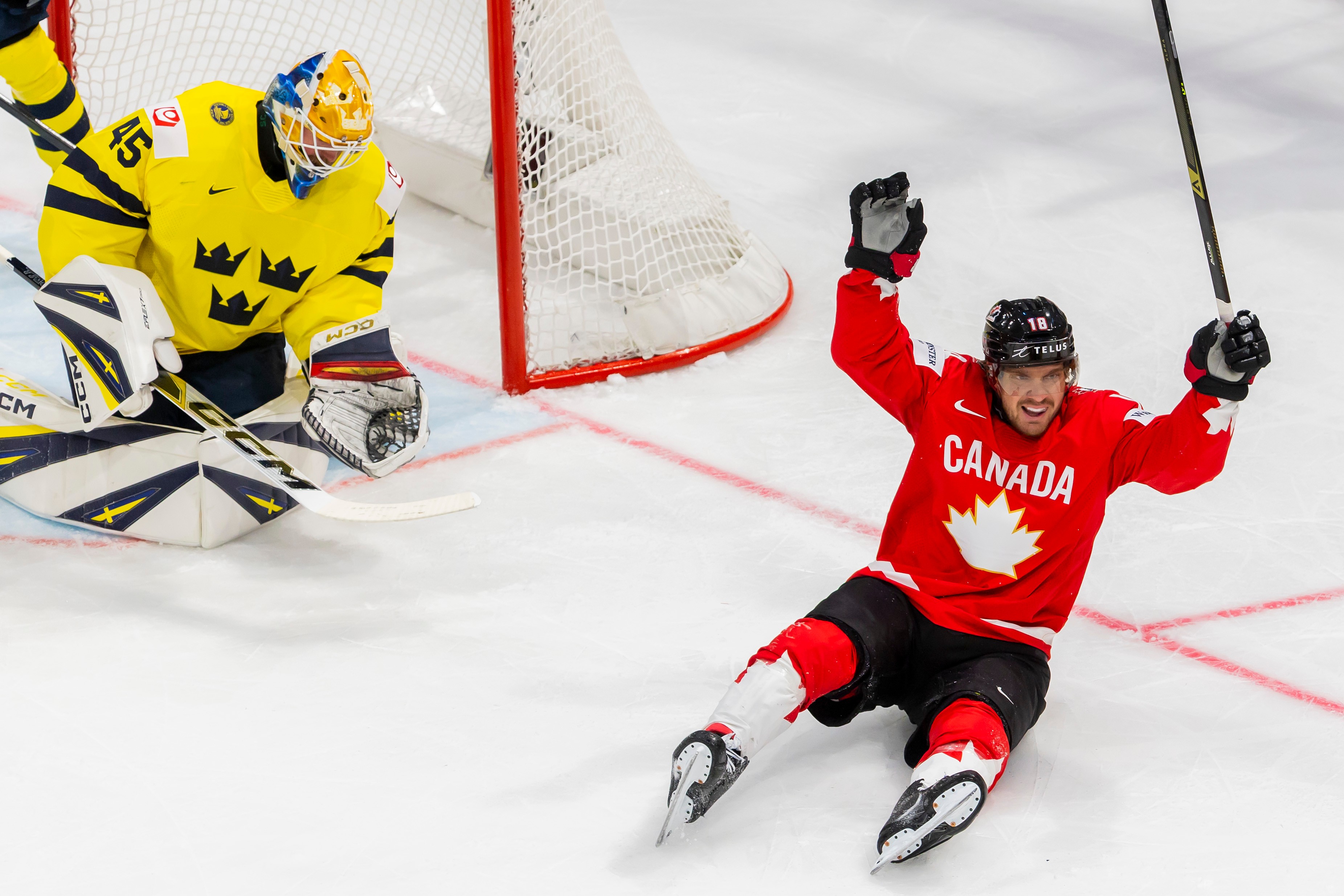 Canada's Robert Thomas celebrates after teammate Dylan Cozens scored a goal during a Group B preliminary round game between Canada and Sweden at the men's ice hockey world championship in Fribourg, Switzerland, Friday, May 15, 2026. 