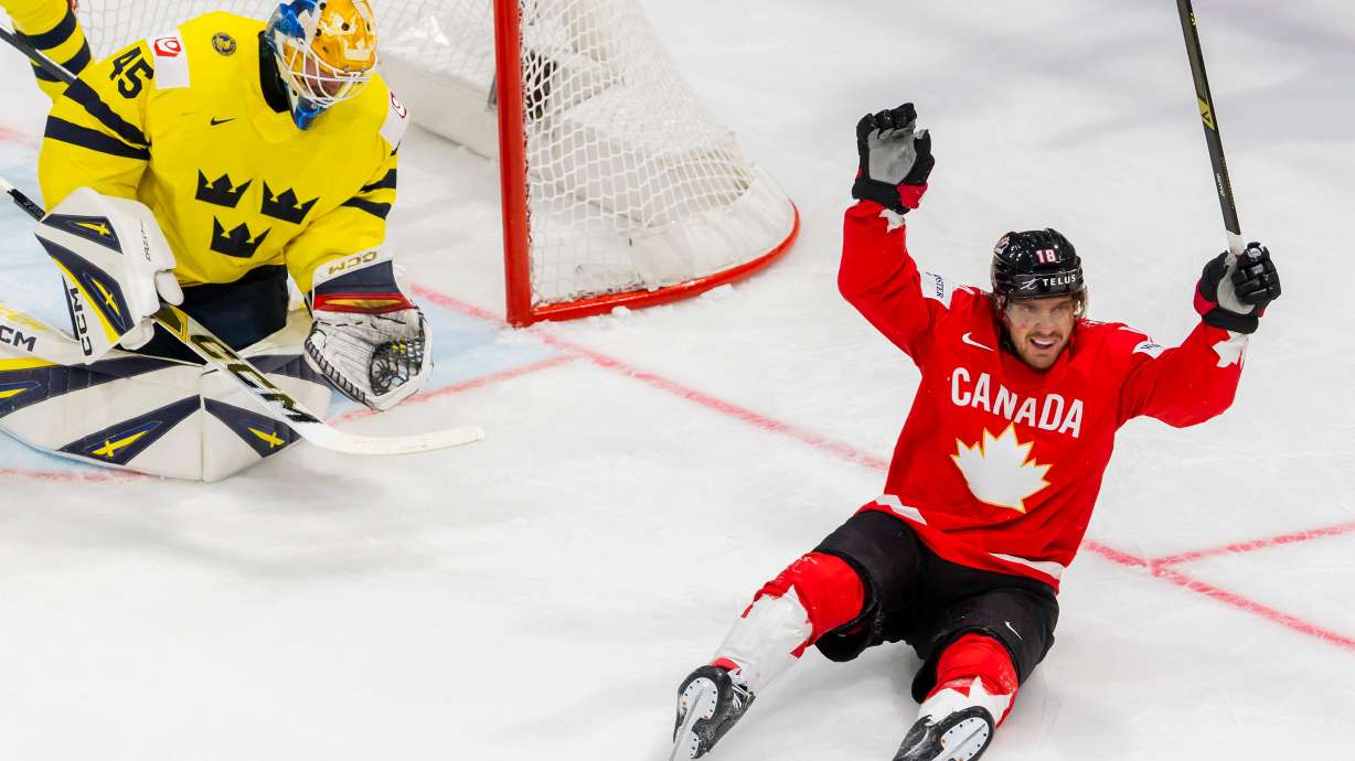 Canada's Robert Thomas celebrates after teammate Dylan Cozens scored a goal during a Group B preliminary round game between Canada and Sweden at the men's ice hockey world championship in Fribourg, Switzerland, Friday, May 15, 2026.