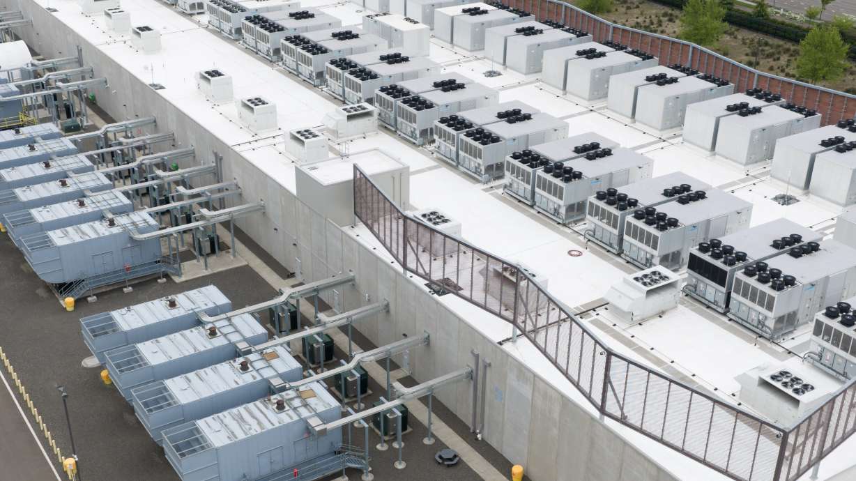 Fans that are part of a cooling system are seen on the roof of a data center, April 27, in Hillsboro, Ore. Progressive lawmakers in Congress are pushing for moratoriums on the construction of AI data centers until nationwide safeguards are put in place.