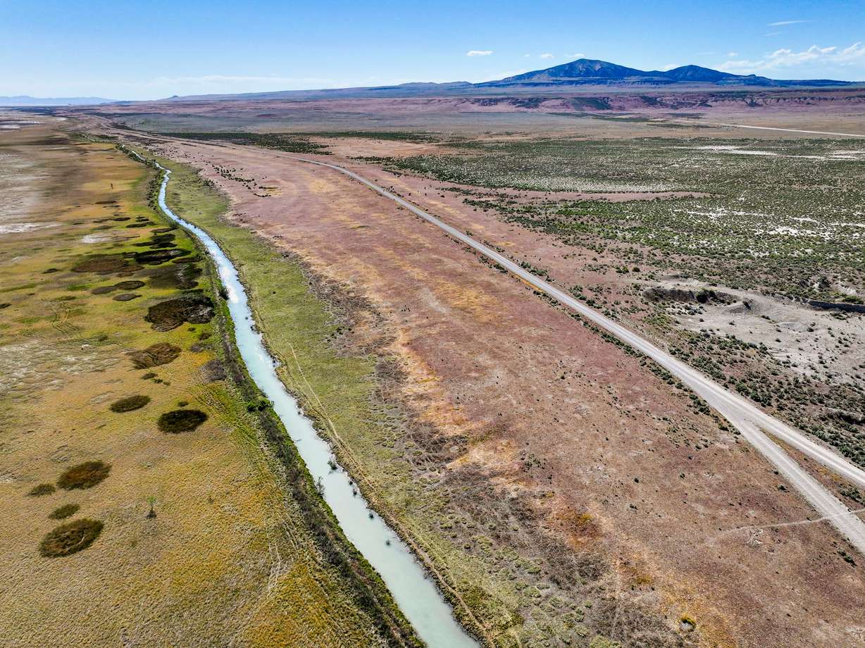 A stream flows near land proposed to be used for the Stratos Project data center is pictured in the Hansel Valley area of Box Elder County on Tuesday. Progressive lawmakers in Congress are teaming up to propose a moratorium on data centers.