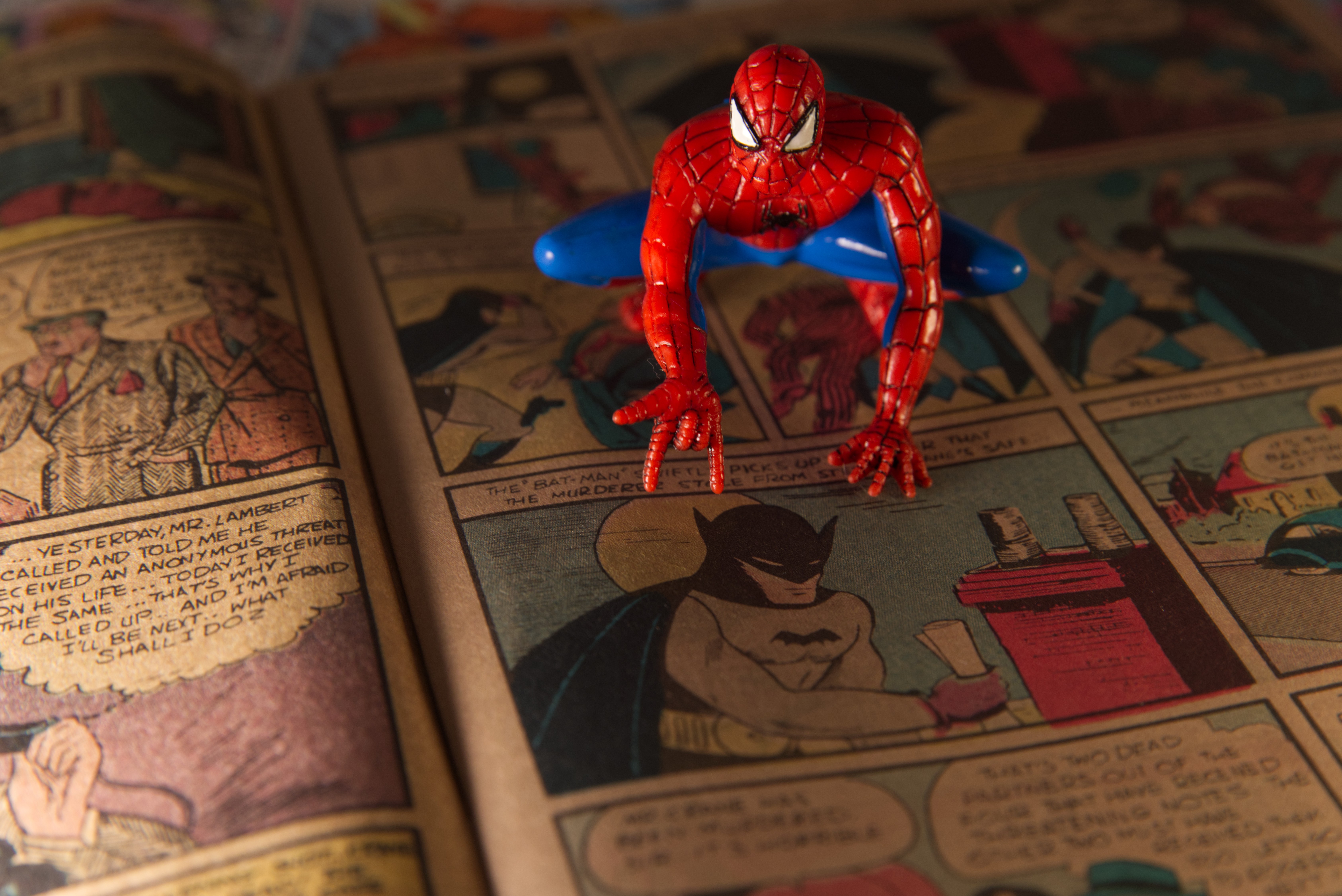 A Spiderman figurine sits atop a facsimile copy of the May 1939 Detective Comics anthology series in Phoenix. This issue made history for including the debut of the Batman superhero in a story called "The Case of the Chemical Syndicate."