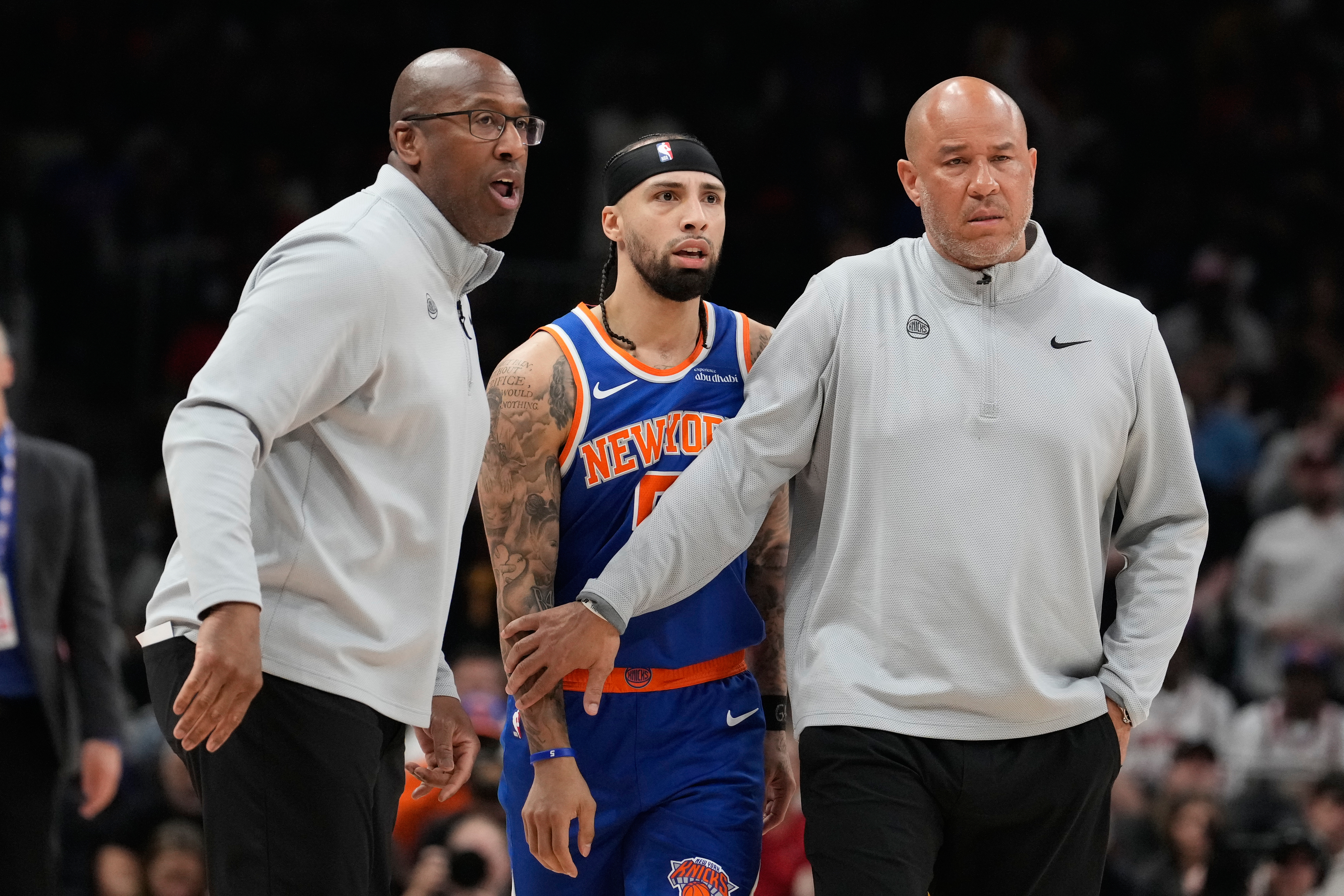New York Knicks head coach Mike Brown holds back New York Knicks guard Jose Alvarado (5) with another coach during the first half of Game 4 in a first-round NBA playoffs basketball series against the Atlanta Hawks Saturday, April 25, 2026, in Atlanta. 