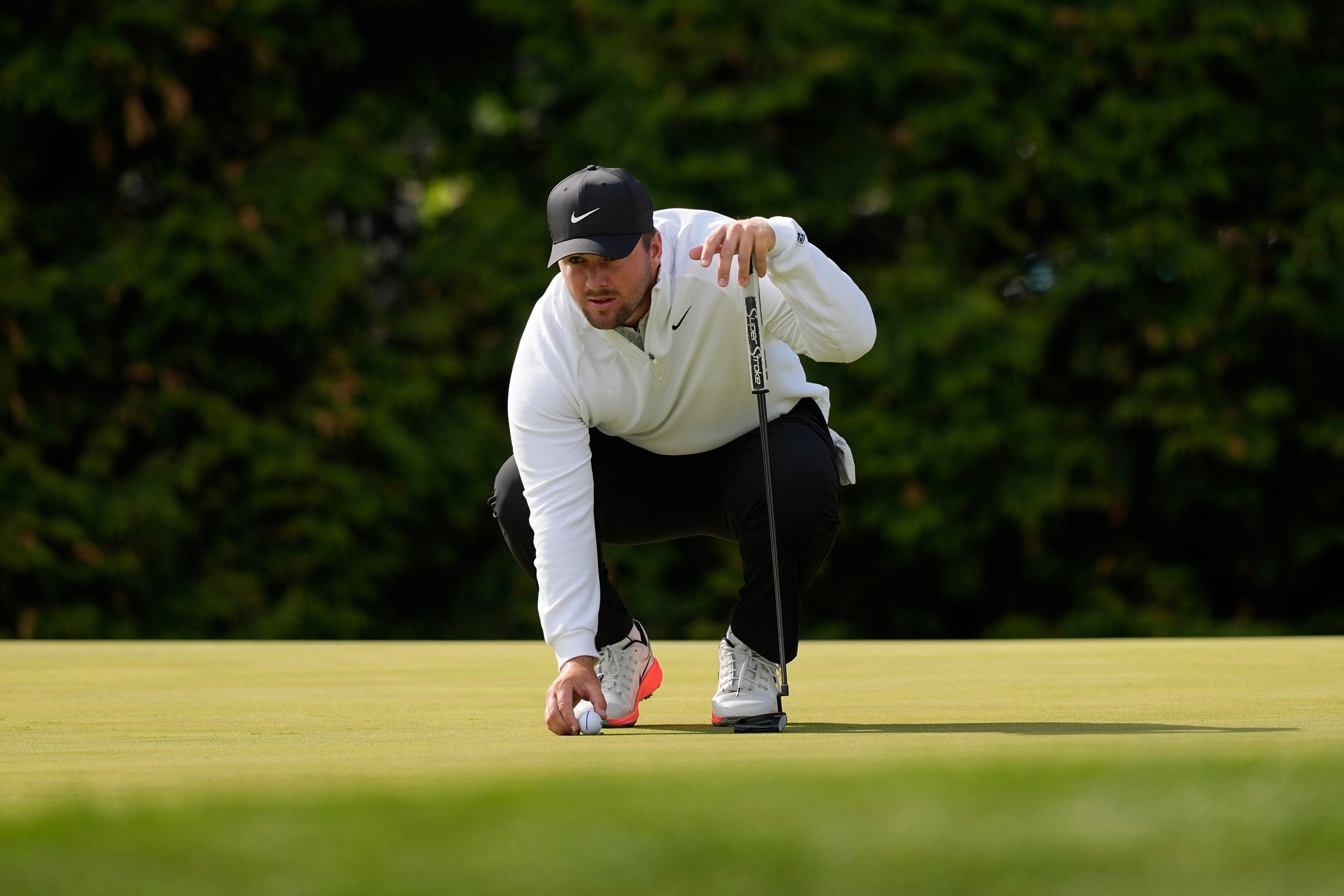 Chris Gotterup lines up his ball on the 12th green during the second round of the PGA Championship golf tournament at Aronimink Golf Club, Friday, May 15, 2026, in Newtown Square, PA. 