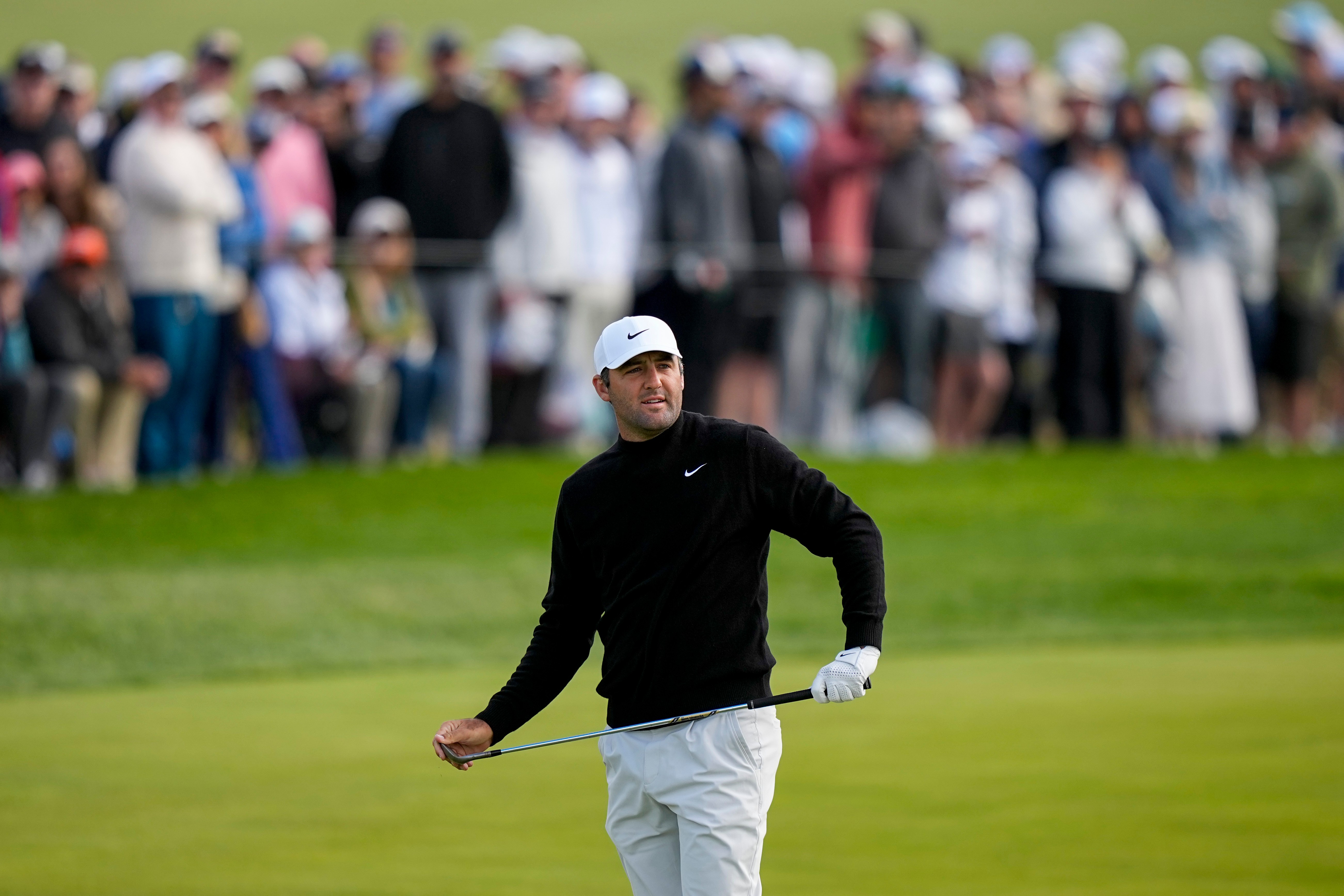 Scottie Scheffler watches his shot on the 10th green during the second round of the PGA Championship golf tournament at Aronimink Golf Club, Friday, May 15, 2026, in Newtown Square, PA. 