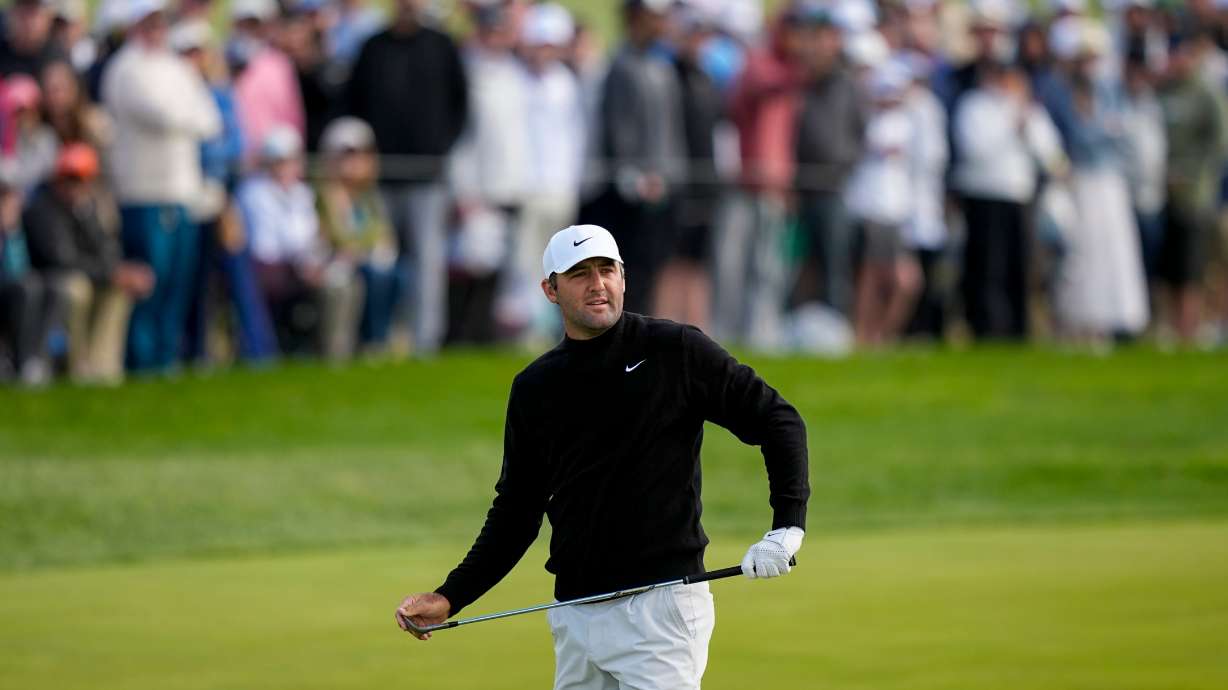 Scottie Scheffler watches his shot on the 10th green during the second round of the PGA Championship golf tournament at Aronimink Golf Club, Friday, May 15, 2026, in Newtown Square, PA.