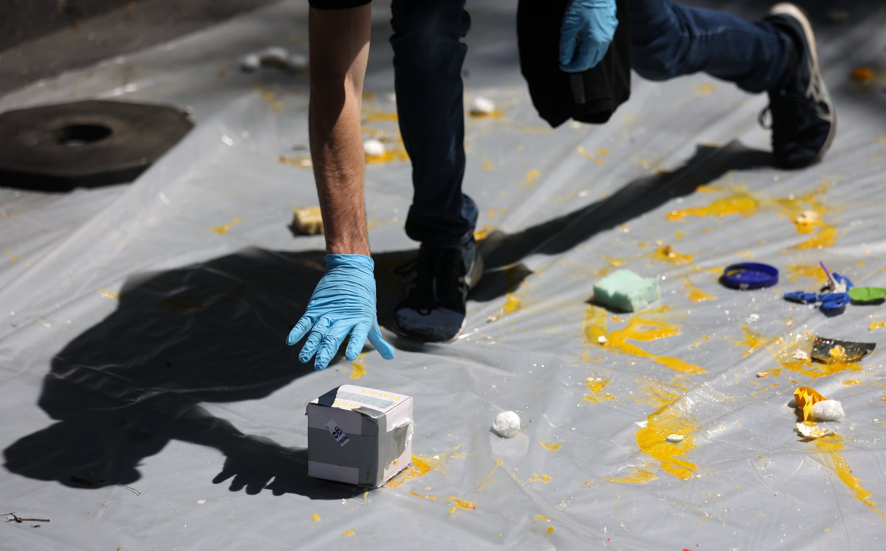Splattered eggs cover the ground below the Sky Ride where an egg-drop contest is taking place during Utah State University Physics Day at Lagoon Amusement Park in Farmington on Friday. Thousands of teens from Utah, Idaho, Wyoming and Nevada participate in the STEM learning event.