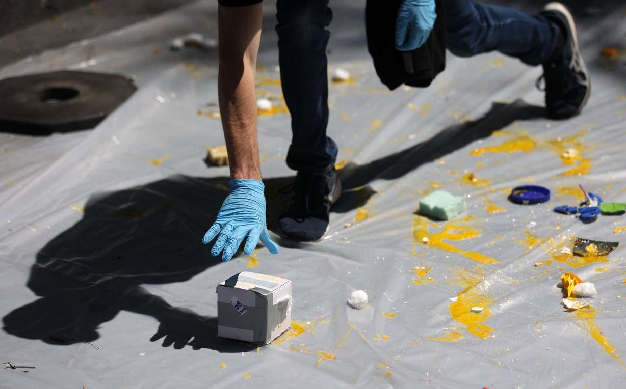 Splattered eggs cover the ground below the Sky Ride where an egg-drop contest is taking place during Utah State University Physics Day at Lagoon Amusement Park in Farmington on Friday. Thousands of teens from Utah, Idaho, Wyoming and Nevada participate in the STEM learning event.