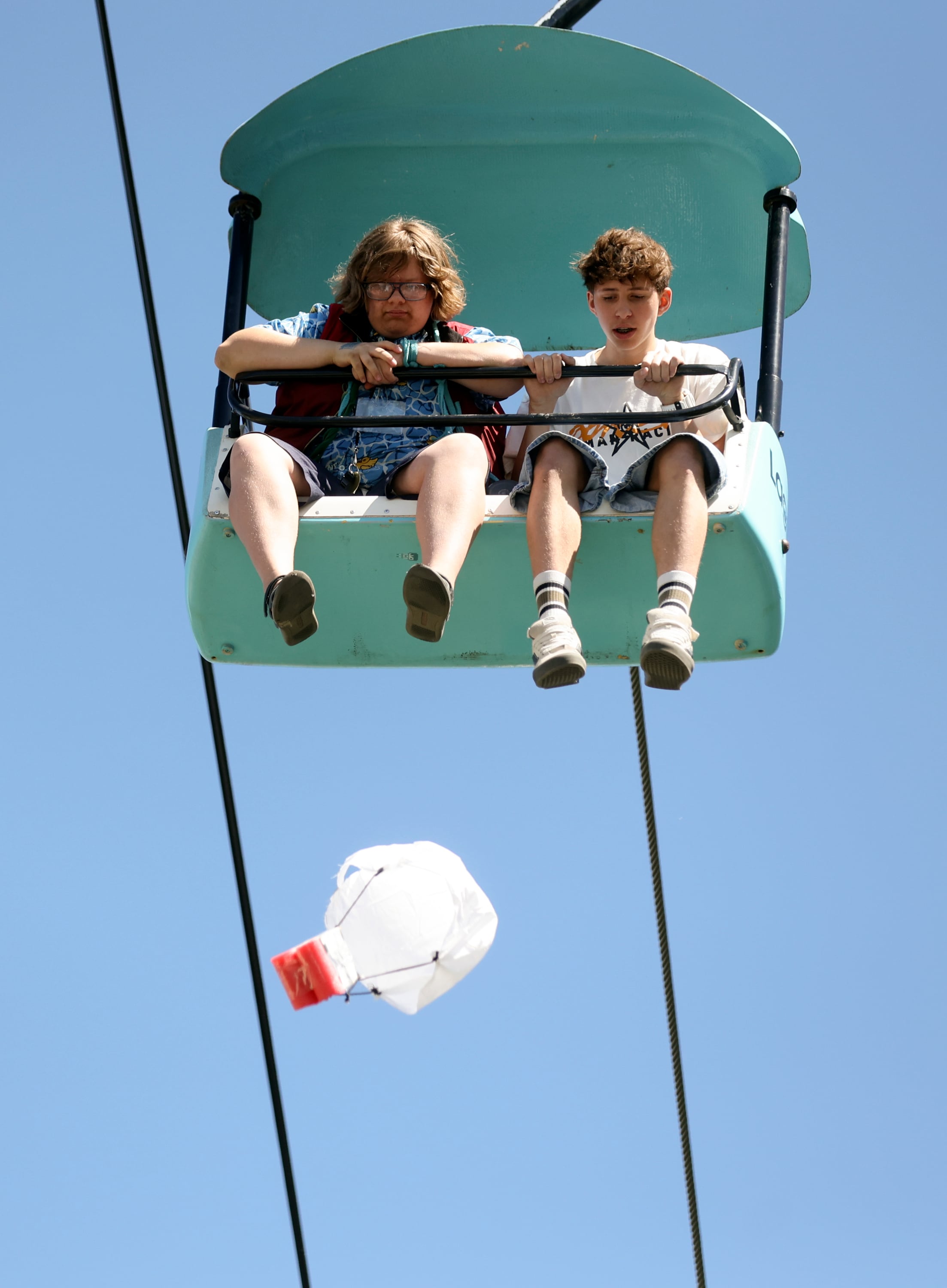 Students drop an egg from the Sky Ride to see if it survives the drop and if they can get it to land in the center of a bullseye target on the ground during Utah State University Physics Day at Lagoon Amusement Park in Farmington on Friday. Thousands of teens from Utah, Idaho, Wyoming and Nevada participate in the STEM learning event.