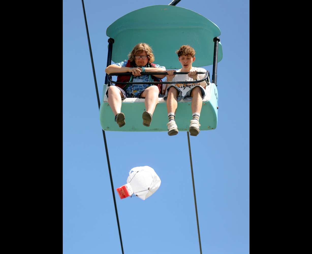 Students drop an egg from the Sky Ride to see if it survives the drop and if they can get it to land in the center of a bullseye target on the ground during Utah State University Physics Day at Lagoon Amusement Park in Farmington on Friday. Thousands of teens from Utah, Idaho, Wyoming and Nevada participate in the STEM learning event.