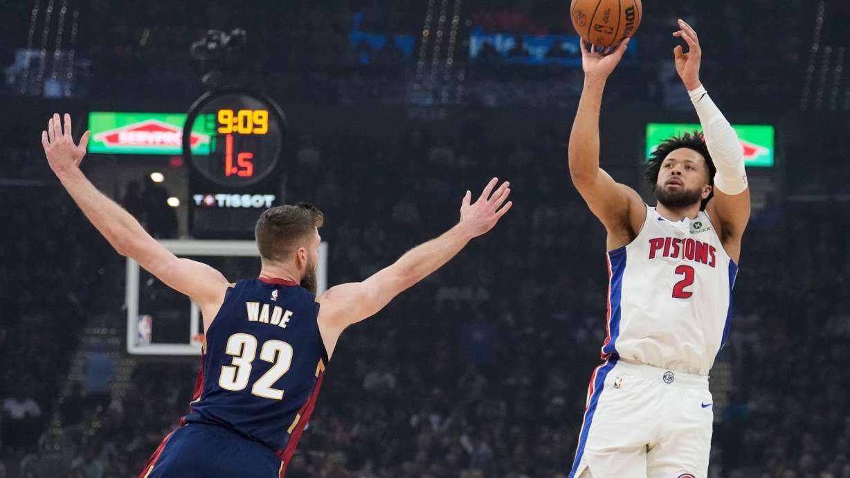 Detroit Pistons' Cade Cunningham (2) shoots over Cleveland Cavaliers' Dean Wade (32) in the first half of Game 6 of a second-round NBA basketball playoffs series Friday, May 15, 2026, in Cleveland.