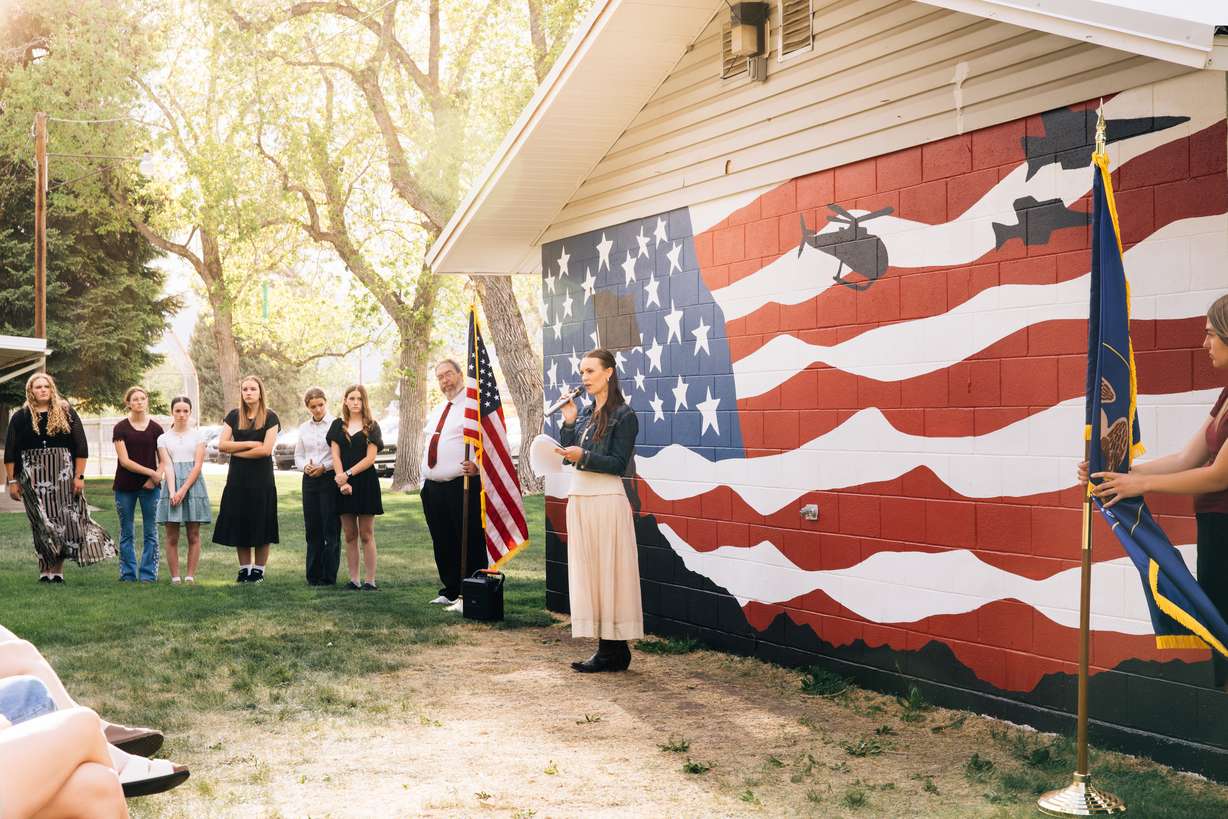 South Sevier Middle School teacher Payton Ashby speaks at an unveiling ceremony on Friday, for a mural her students painted at Lion's Park in Monroe to commemorate the country's 250th anniversary.