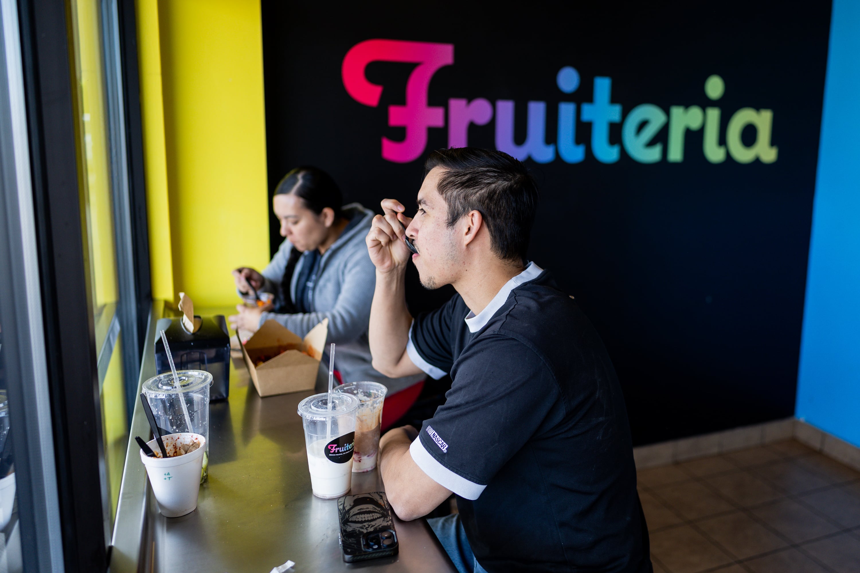 Orlando Garcia, right, and Ingrid Cano, left, eat at Fruiteria in Orem on May 8.