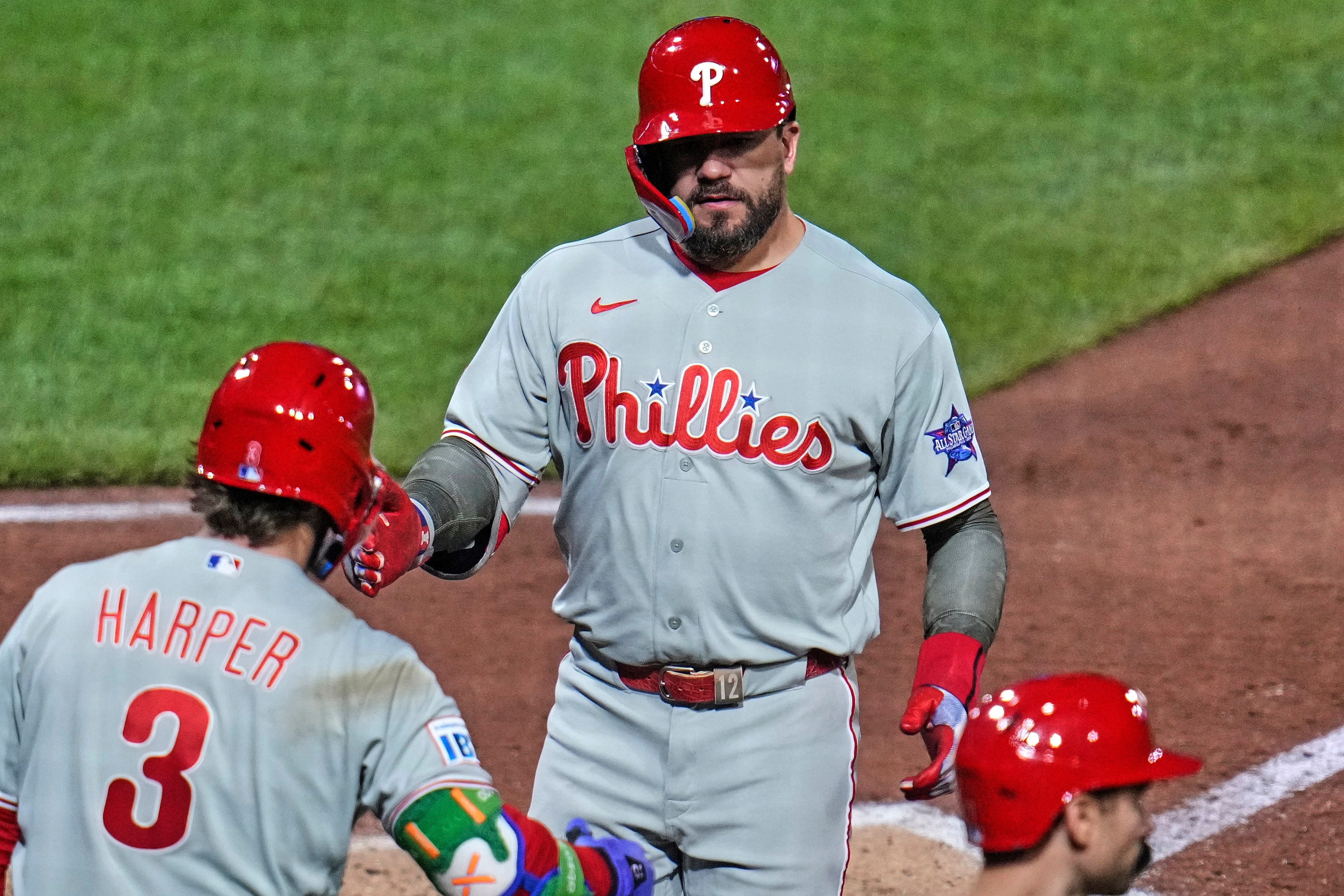 Philadelphia Phillies' Kyle Schwarber, top, is greeted by Bryce Harper (3) as he crosses home plate after hitting a two-run home run off Pittsburgh Pirates pitcher Mason Montgomery during the seventh inning of a baseball game in Pittsburgh, Friday, May 15, 2026. 