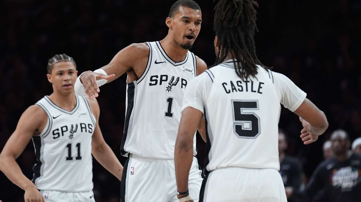 San Antonio Spurs forward Victor Wembanyama (1) celebrates a score with guard Stephon Castle (5) during the first half of Game 6 of an NBA basketball second-round playoffs series in Minneapolis, Friday, May 15, 2026.