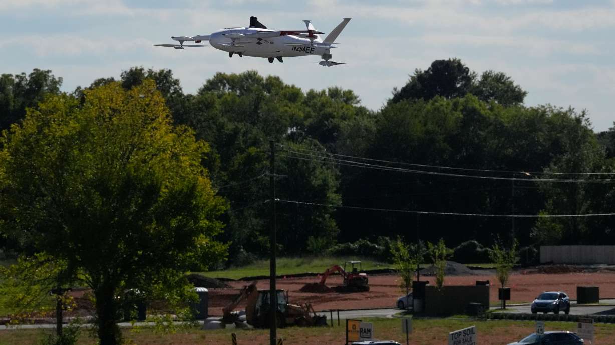 A drone operated by Zipline flies to make a delivery from a Walmart store in Pea Ridge, Ark., Sept. 26, 2025.