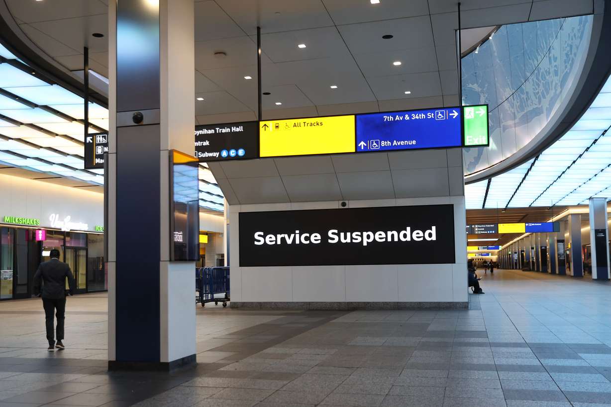Service suspended signs are posted inside Penn Station on the first day of a Long Island Rail Road strike, Saturday, in New York. The walkout is the first for the railroad since 1994.