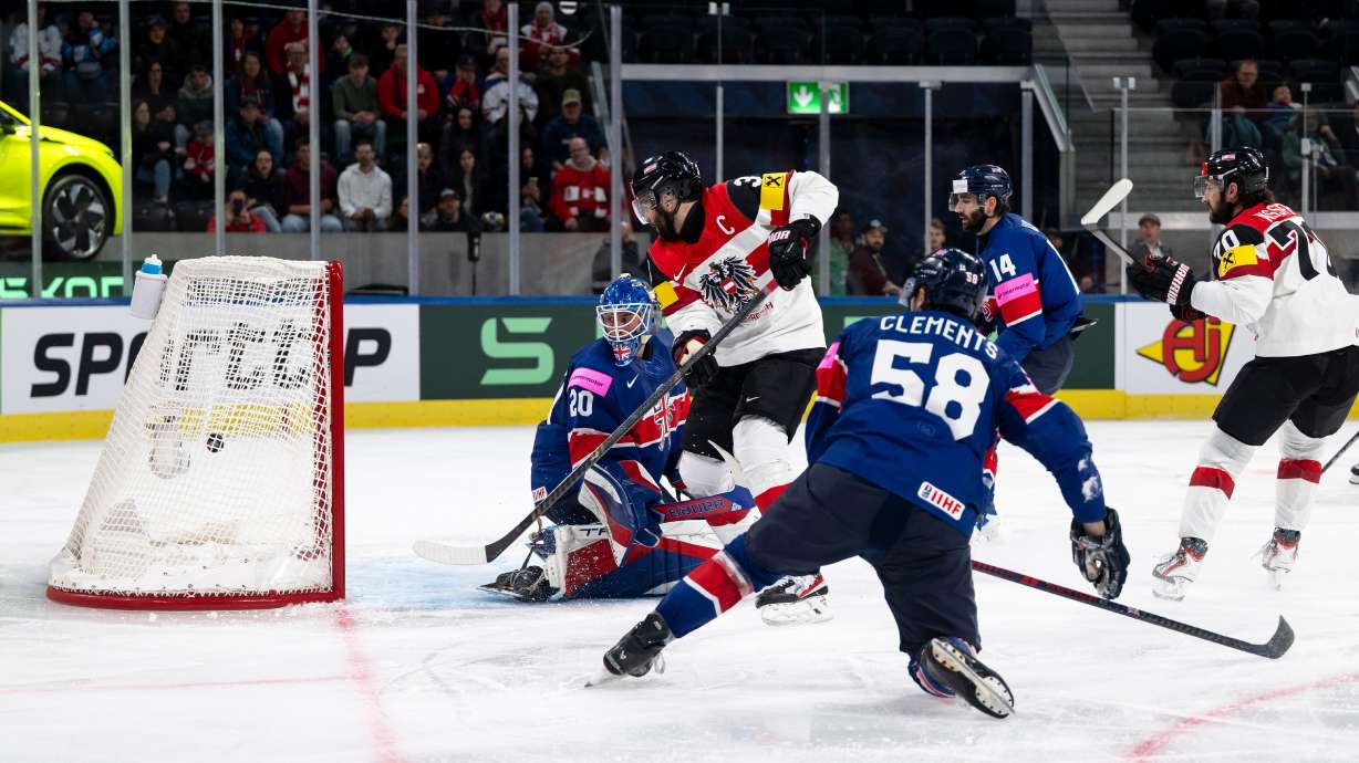 Austria's Peter Schneider, 2nd from left, scores his side's fourth goal past Britain's goaltender Mat Robson, during the 2026 IIHF Men's Ice Hockey World Championship preliminary round group A game between Britain and Austria, in Zurich, Switzerland, Saturday, May 16, 2026.
