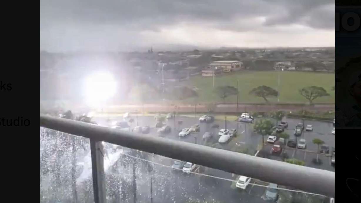 Lightning strikes a utility pole near Waipahu District Park in Waipahu, Hawaii, Friday. It's unknown if the rare strike caused a power outage during an unusual out-of-season winter storm that hit the state, according to Hawaii News Now.
