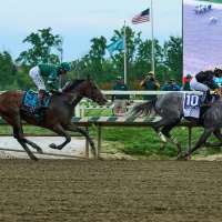 Napoleon Solo holds off Iron Honor by 1 1/4 lengths to win the Preakness at Laurel Park