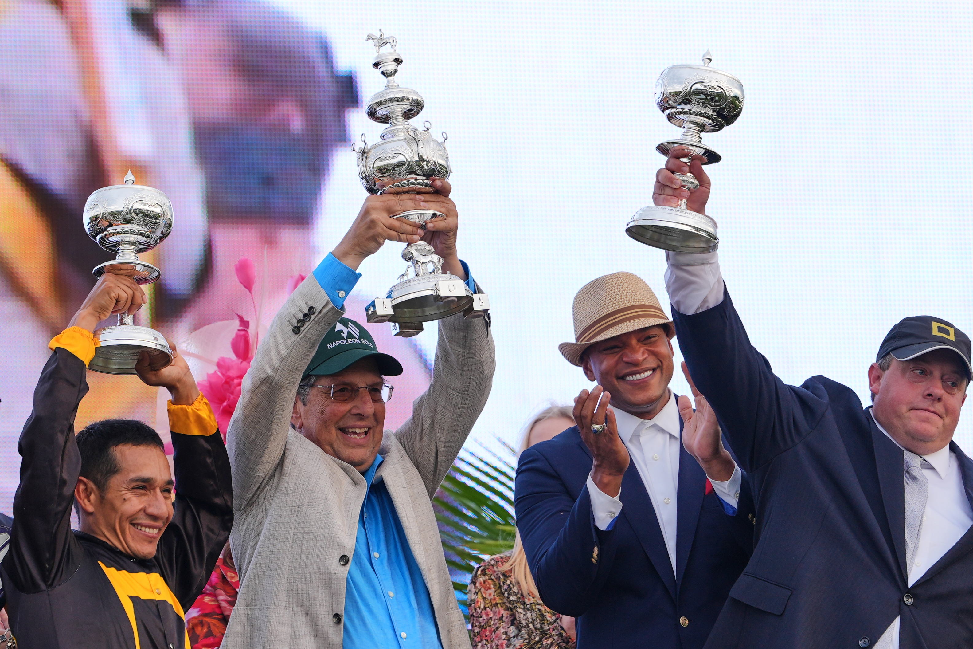 From left, jockey Paco Lopez, owner Al Gold, Maryland Gov. Wes Moore, and trainer Chad Summers celebrate after Napoleon Solo won the 151st running of the Preakness Stakes horse race, Saturday, May 16, 2026, at Laurel Park in Laurel, Md.