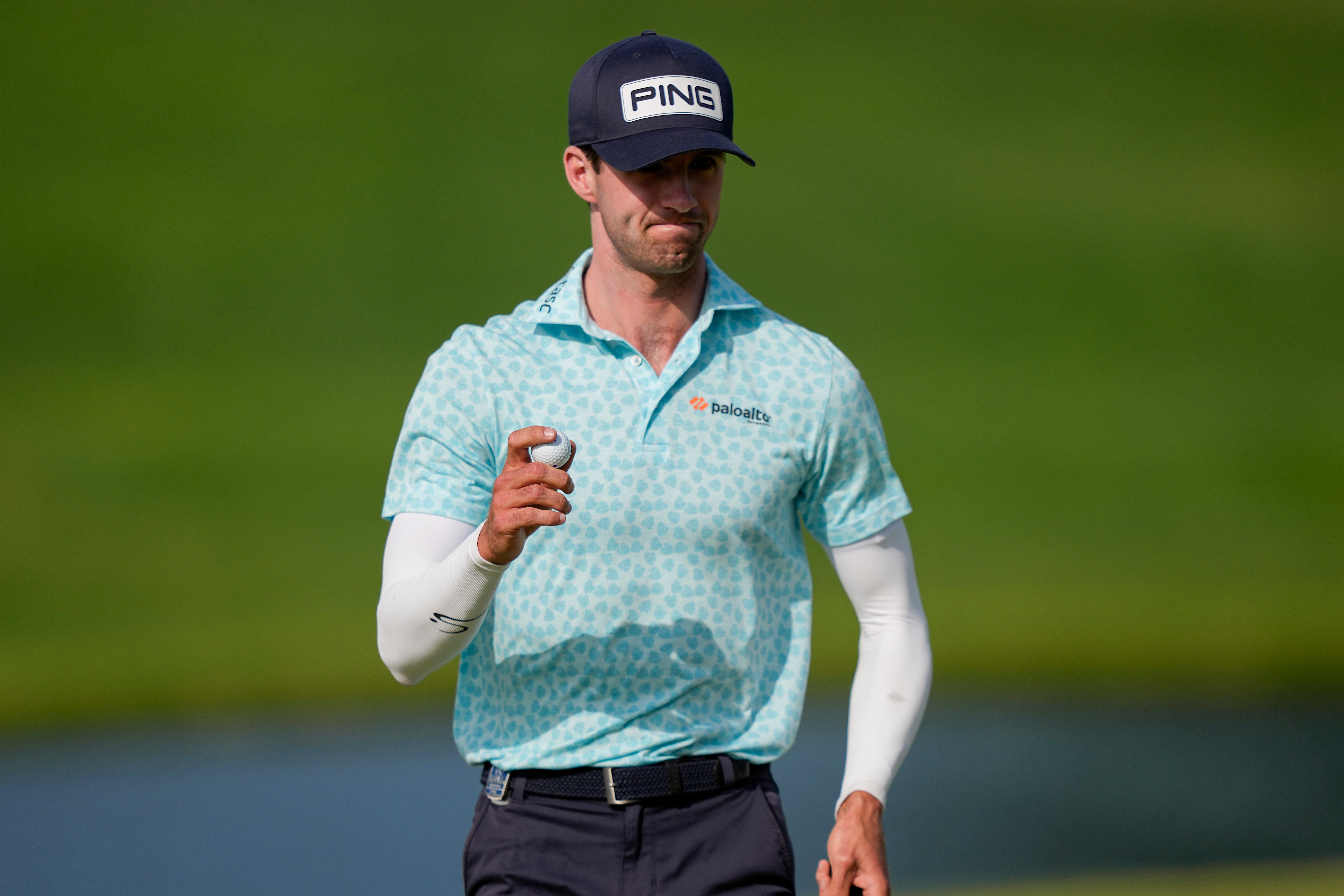 Alex Smalley waves on the 10th green during the third round of the PGA Championship golf tournament at Aronimink Golf Club, Saturday, May 16, 2026, in Newtown Square, PA. 