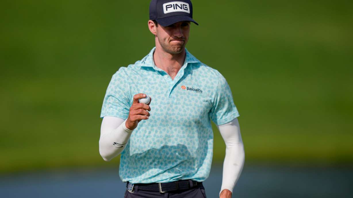 Alex Smalley waves on the 10th green during the third round of the PGA Championship golf tournament at Aronimink Golf Club, Saturday, May 16, 2026, in Newtown Square, PA.