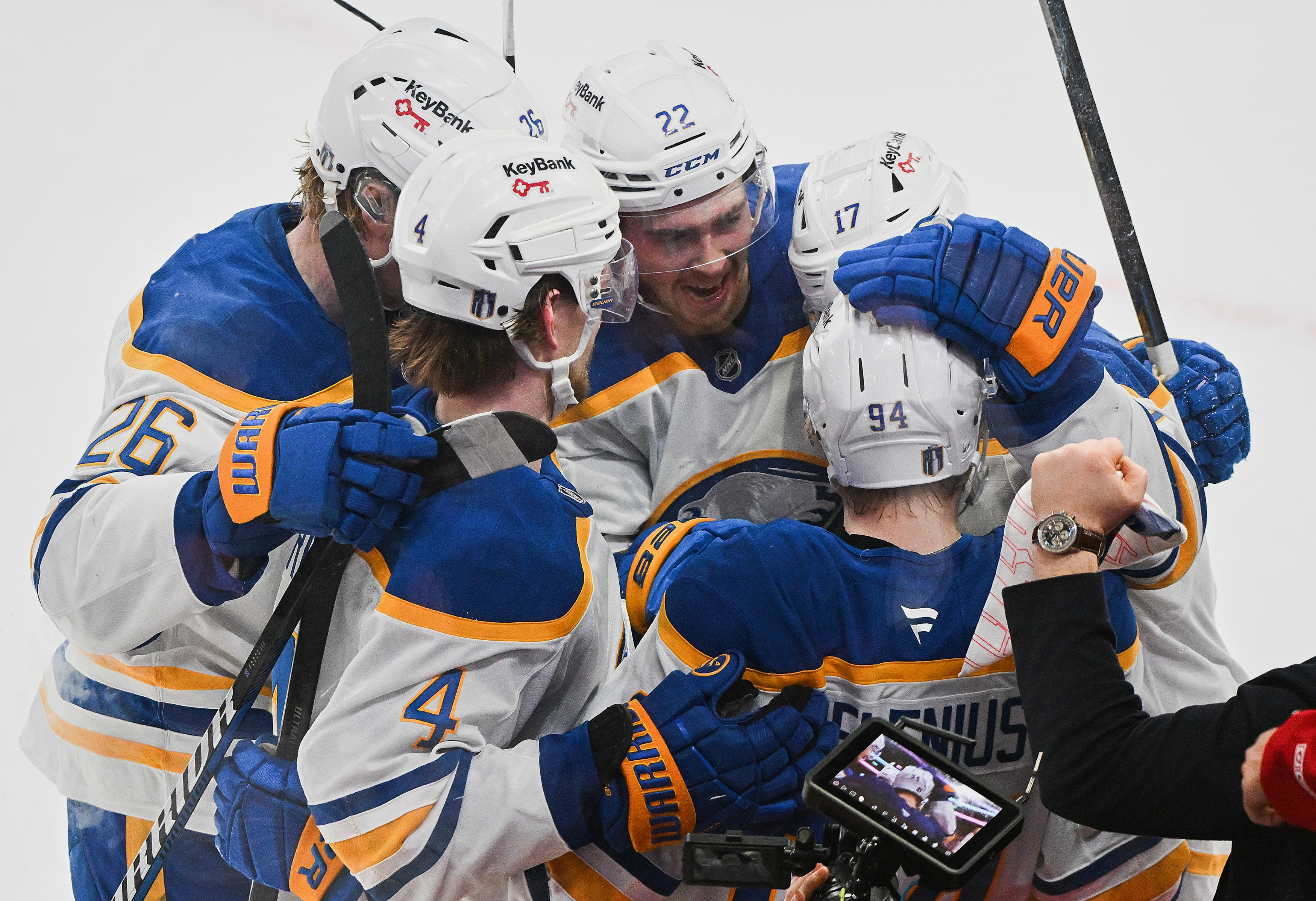 Buffalo Sabres' Konsta Helenius (94) celebrates with teammates after scoring against the Montreal Canadiens during the second period of Game 6 in a second-round NHL hockey Stanley Cup playoff series in Montreal, Saturday, May 16, 2026. 